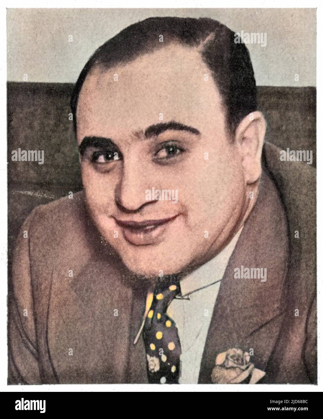 Alphonse 'Scarface' Capone, a prominent citizen of Chicago who unfortunately experienced trouble with the Internal Revenue service Colourised version of : 10083256       Date: 1930 Stock Photo