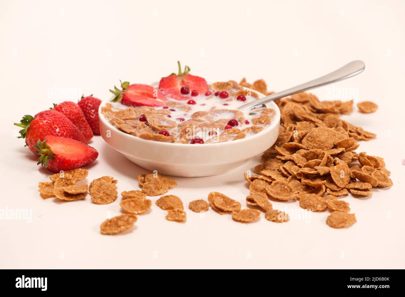 Cereals drenched in milk - quick breakfast with fruits and berries Stock Photo