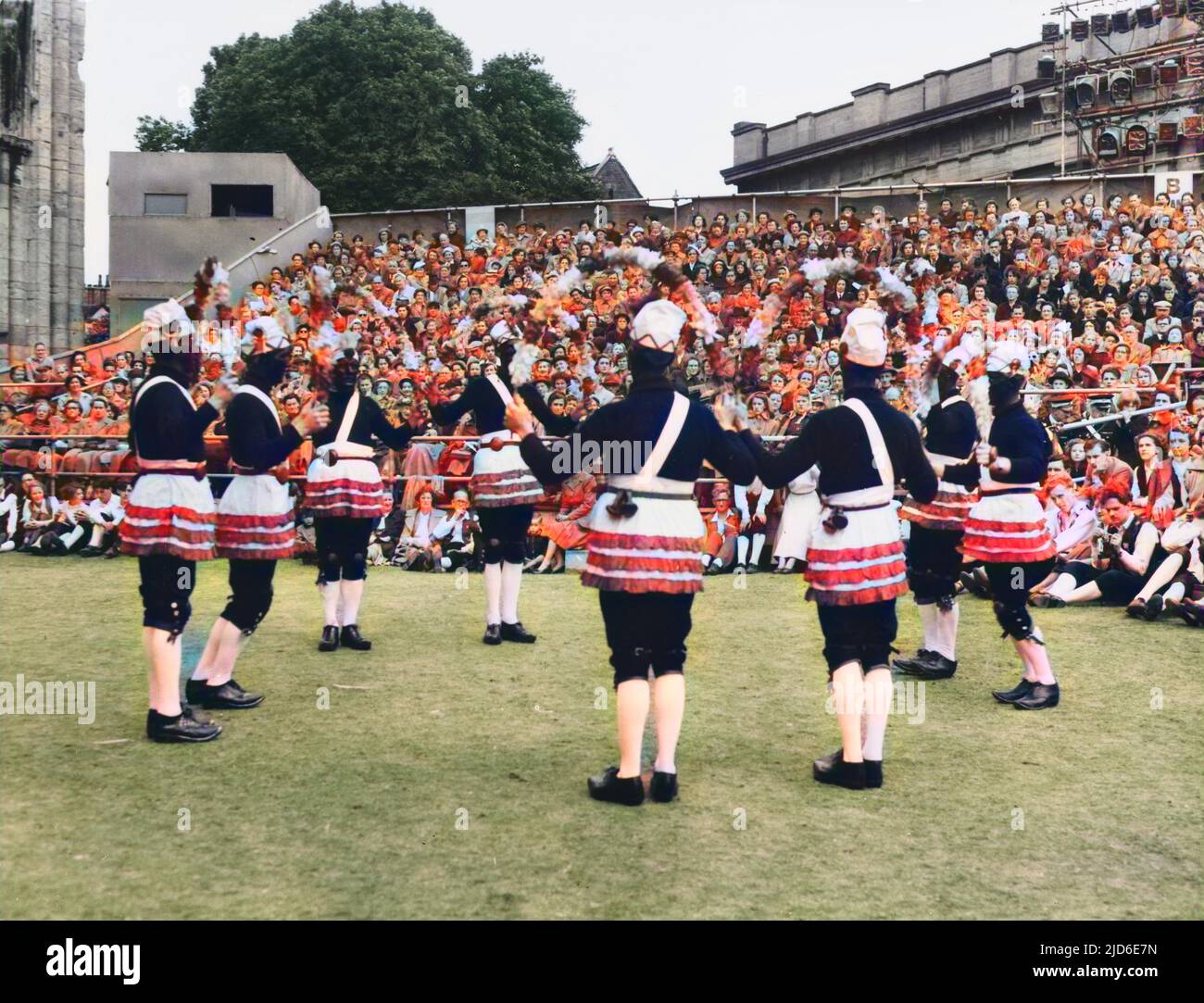 EASTER CUSTOM NUTTERS DANCE. Britannia Bacup Coconut Dancers of Lancashire at the York Summer Festival. The dance is led by a whipper-in who whips the winter away! Colourised version of : 10088918       Date: 1950s Stock Photo
