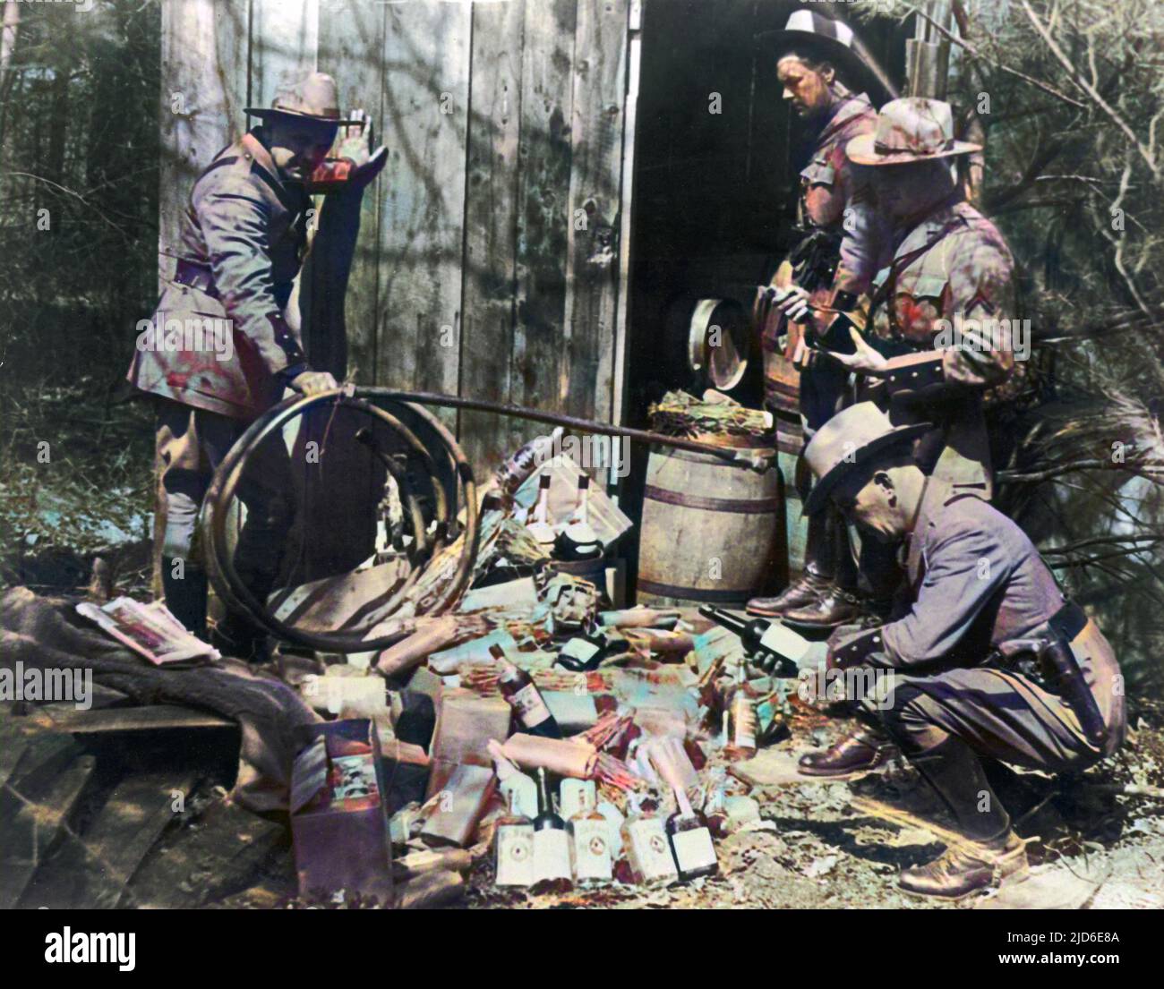 American Police raid an illegal still and destroy bootlegging equipment. Colourised version of : 10101680       Date: early 1930s Stock Photo