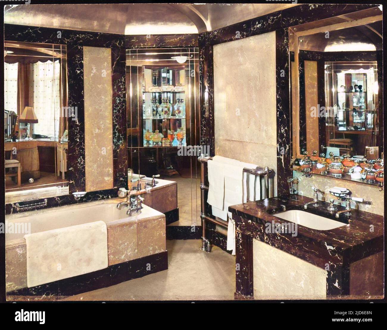 Luxury Art Deco en suite bathroom in various types of marble, with a