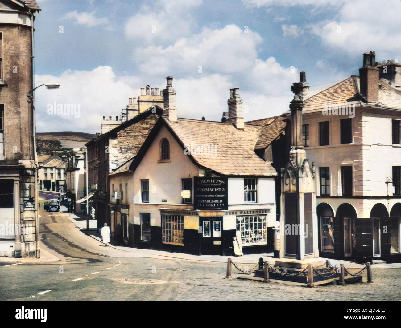 The town centre at Ulverston, Cumbria, a market town a few miles south of the English Lake District. Colourised version of : 10146533       Date: 1950s Stock Photo