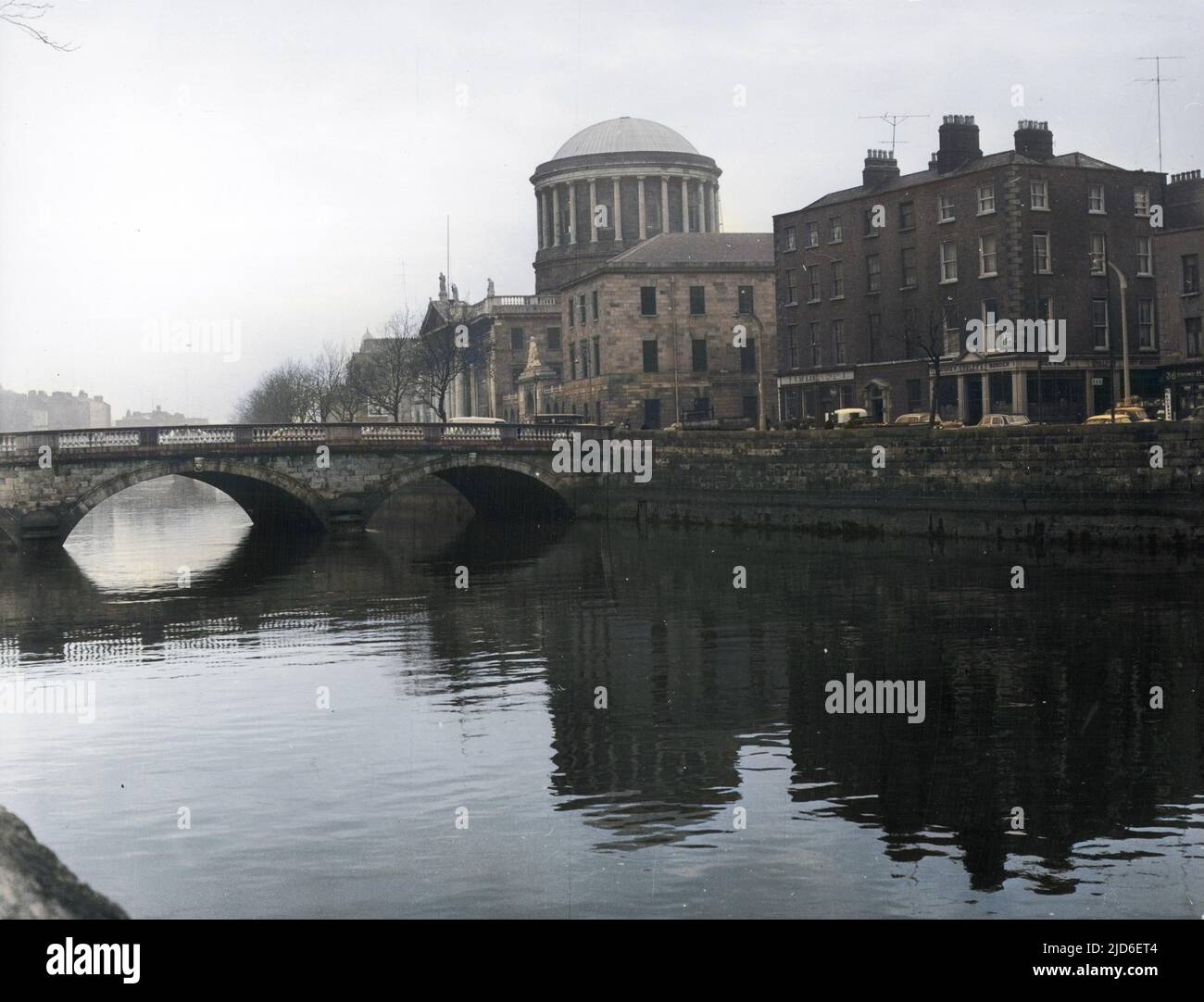 The Four Courts, home of the Irish Law Courts, by the River Liffey, Dublin, Co Dublin, Ireland. Colourised version of : 10161320       Date: 1960s Stock Photo