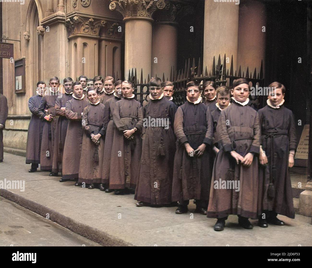 A group of choirboys inside an unspecified church or cathedral. Colourised version of : 10163466       Date: early 1930s Stock Photo