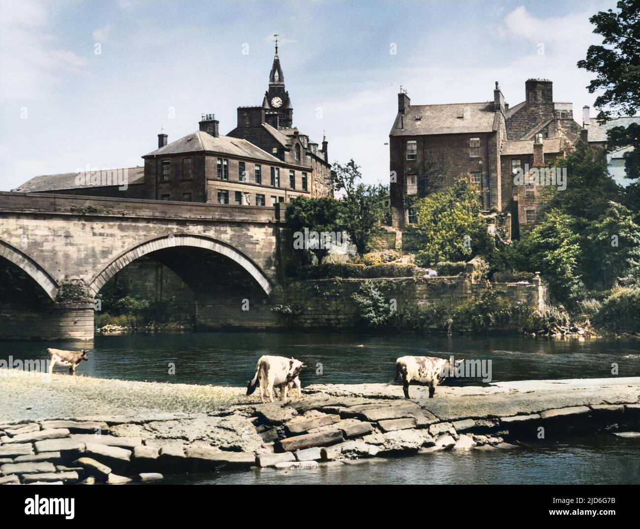A glimpse of Annan, Dumfries-shire, Scotland, from across the River Annan. Colourised version of : 10173447       Date: 1950s Stock Photo