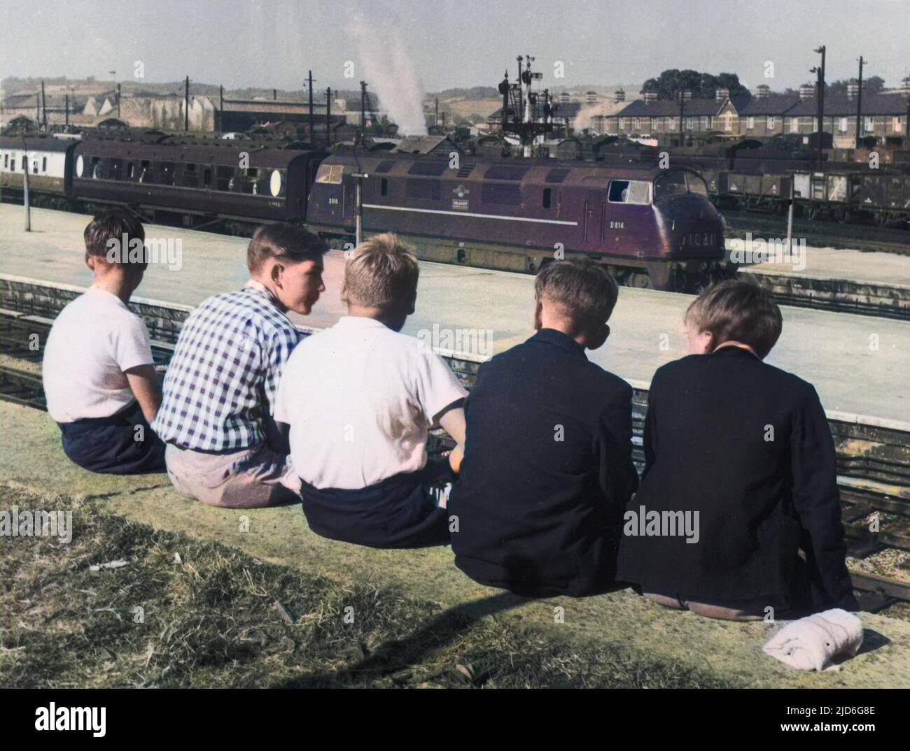 Boy trainspotters at Newton Abbot, Devon, England. In the platform is