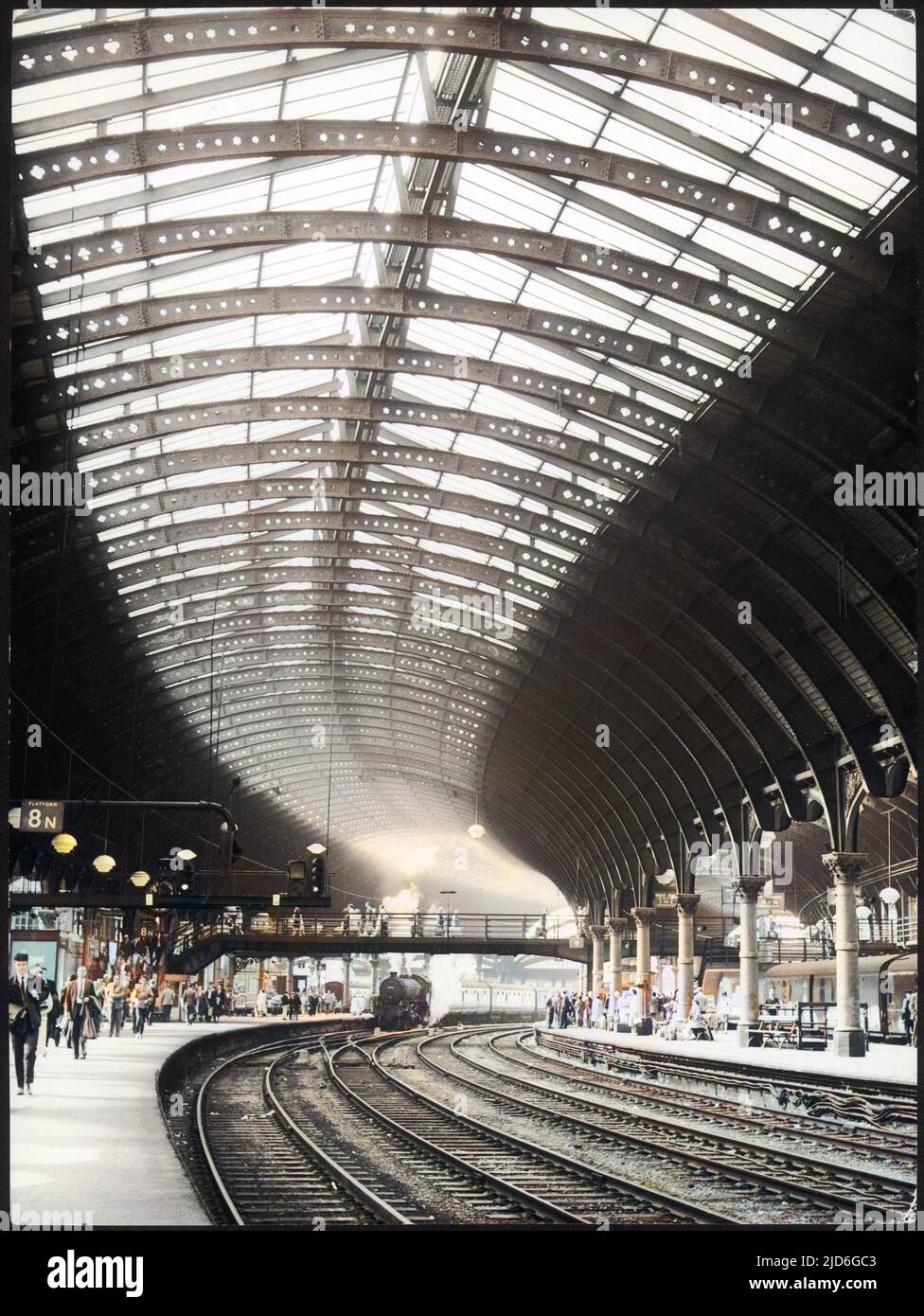 A steam train entering York railway station, Yorkshire, England. Colourised version of : 10170994       Date: circa 1960 Stock Photo