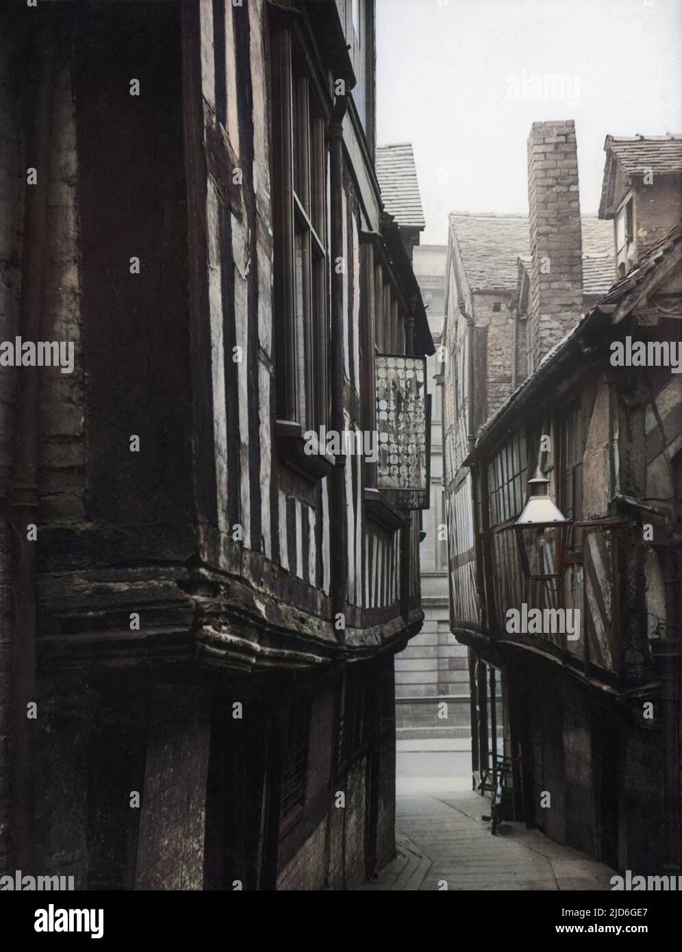 Grope Lane, a quaint medieval alley off the High Street at Shrewsbury, Shropshire, England. Colourised version of : 10171999       Date: 1930s Stock Photo