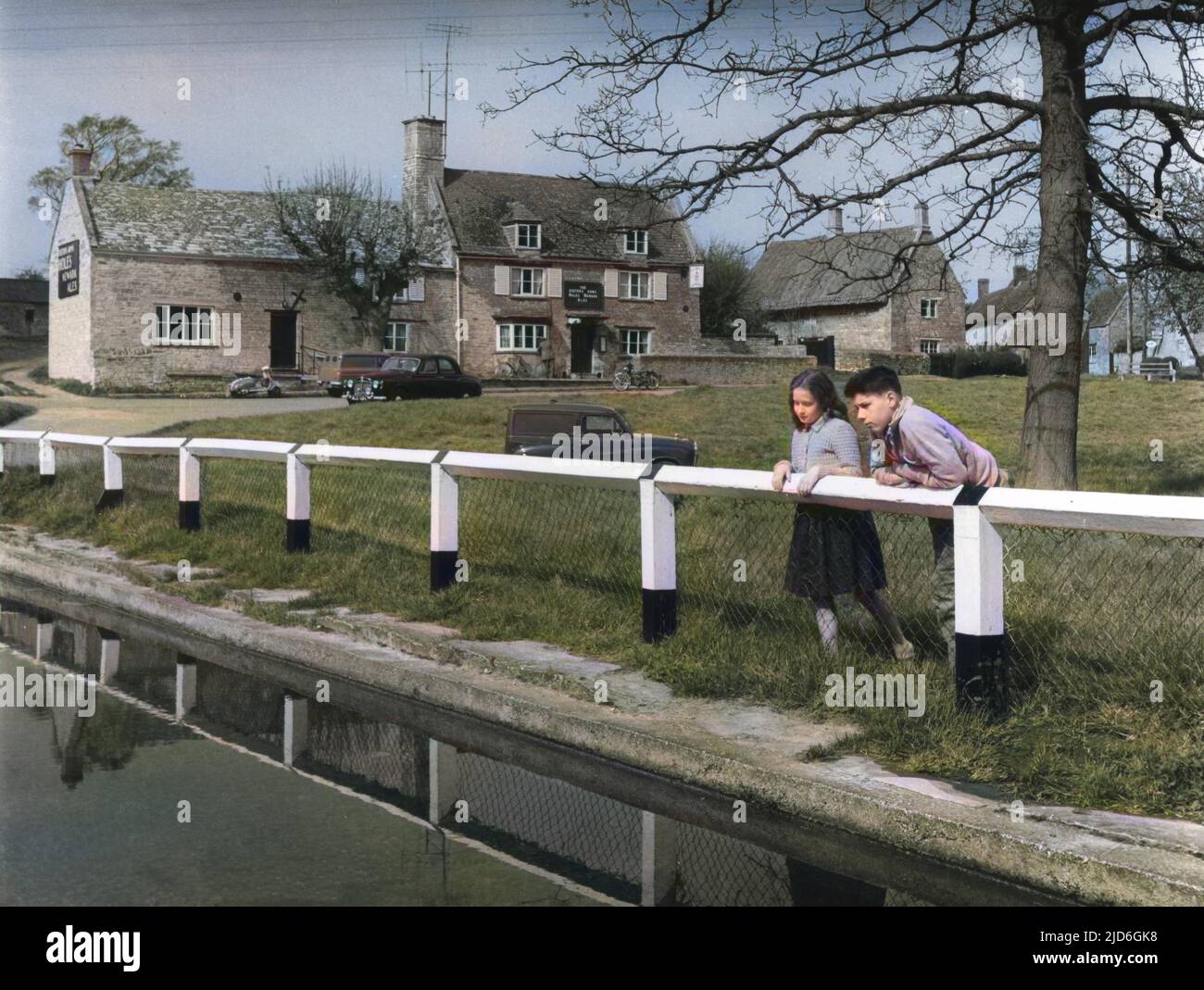 A scene by the village pond and green, showing the 'Exeter Arms ' inn ...
