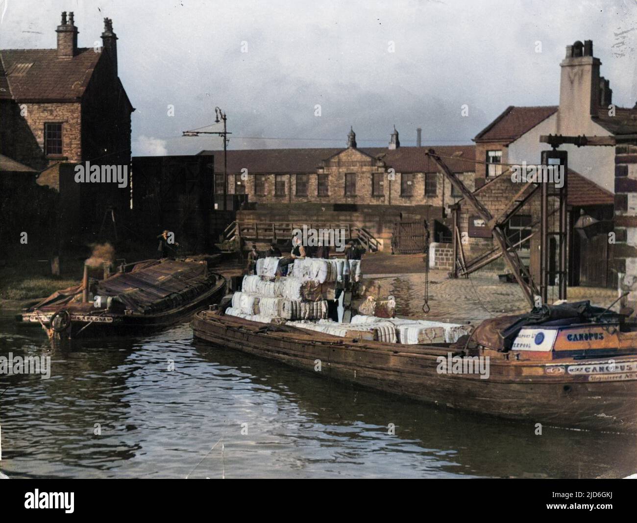 Barges loaded with bales of raw cotton, destined for the cotton mills