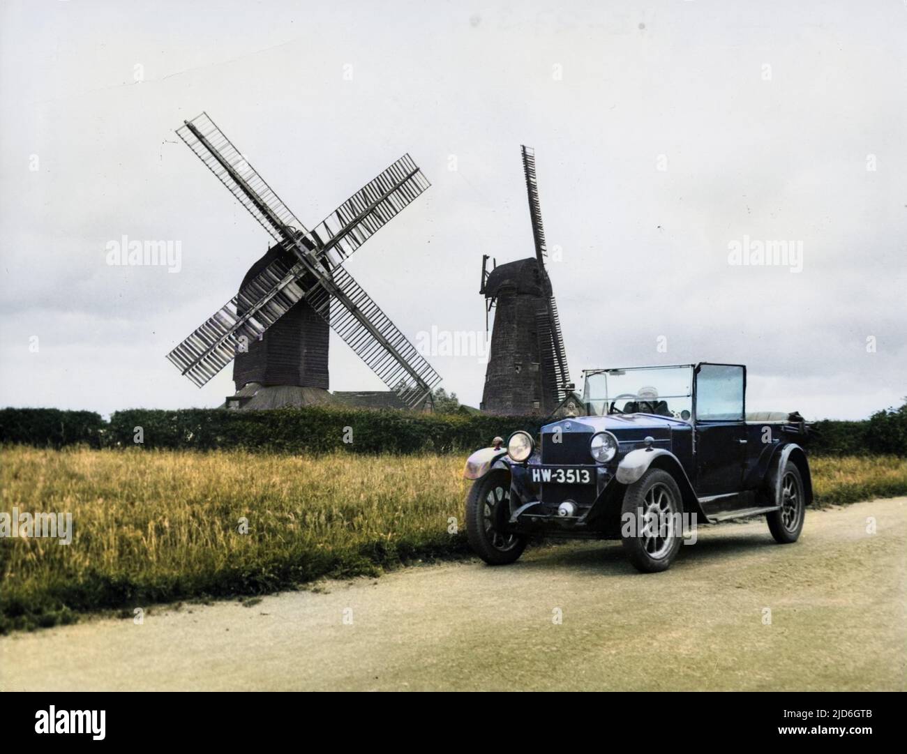 The old (17th century) windmills at Outwood, near Redhill, Surrey, England. The one in the foreground was built in 1665 and is (in 2006) Britain's oldest working windmill. Colourised version of : 10185293       Date: late 1930s Stock Photo