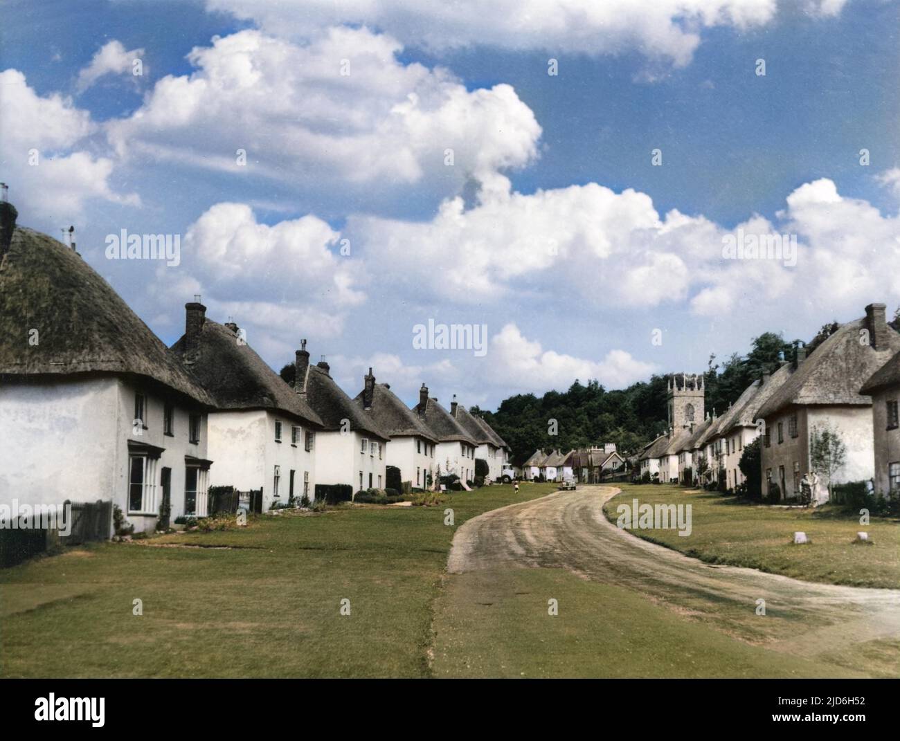 The distinctive charm of the village street of Milton Abbas, Dorset. Built in the 1780s by Sir William Chambers at the request of Lord Milton; an early English model village Colourised version of : 10187998       Date: 1950s Stock Photo