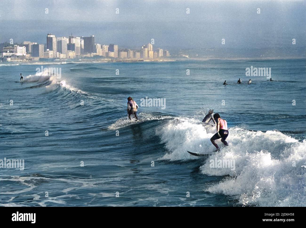 Surfing at Durban, South Africa. Colourised version of 10190275 Date