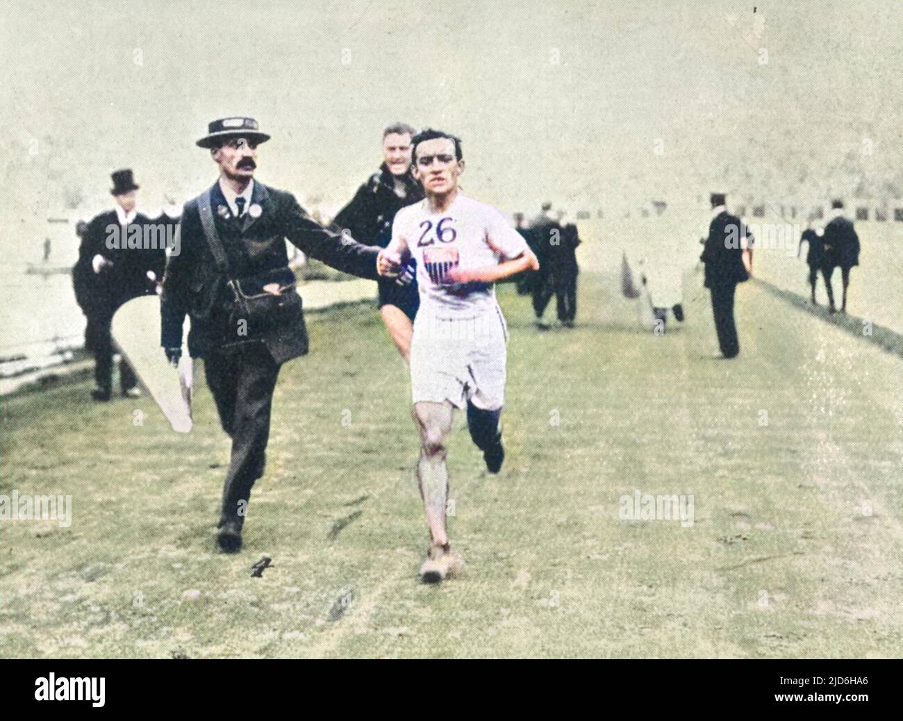 John Hayes, American athlete, in the final leg of the marathon race at the London Olympic Games in 1908. Dorando Pietri of Italy collapsed after entering the stadium ahead of the pack. He was revived by doctors and some of the officials helped him to his feet and then assisted him to the finish line. John Hayes of the United States was the second finisher. Pietri had been declared the winner, but the Americans lodged a protest that was finally upheld. Dorando was nevertheless presented with a special cup by Queen Alexandra for his 'pluck'. Colourised version of: 10217336       Date: 1908 Stock Photo