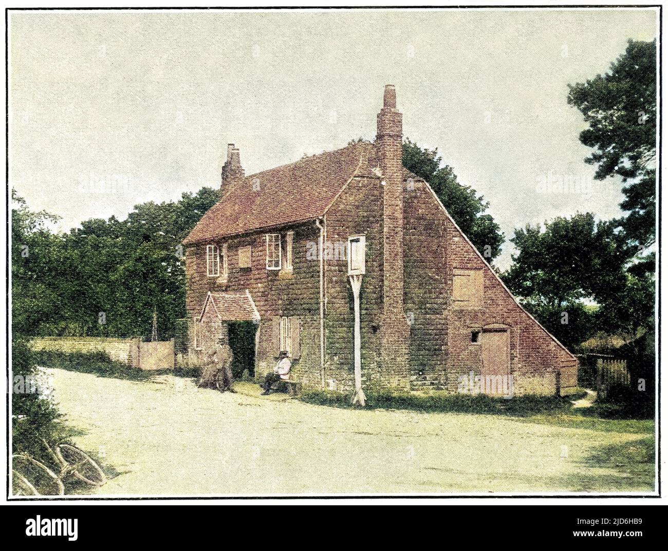 Bat and Ball Public House at Hambledon, circa 1908.   The pub was formerly known as the Broadhalfpenny Hut and was used as a pavilion by the Hambledon Cricket club in the latter half of the eighteenth century.   Broadhalfpenny Down is considered to be the birthplace of modern cricket; hence the importance of the Bat and Ball public house. Colourised version of: 10218941       Date: 1908 Stock Photo