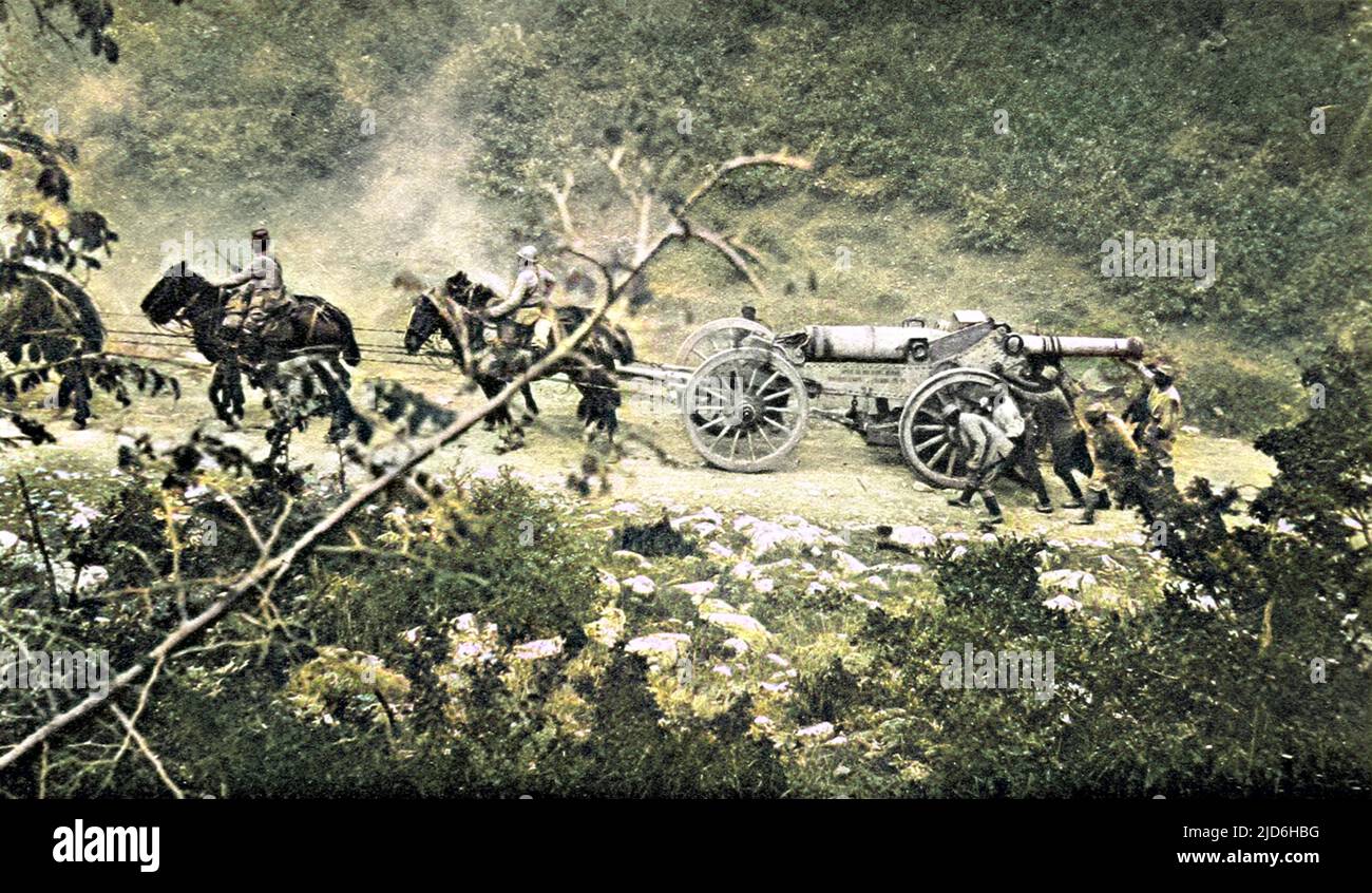 A French heavy-gun battery move up a steep hill during fighting with the Bulgarian army on the Macedonian border, October 1916. The battery was part of the Allied army based at the Greek port of Salonika and required a team of sixteen horses to move the weapon up the sharp incline pictured. Colourised version of: 10219714       Date: 1916 Stock Photo