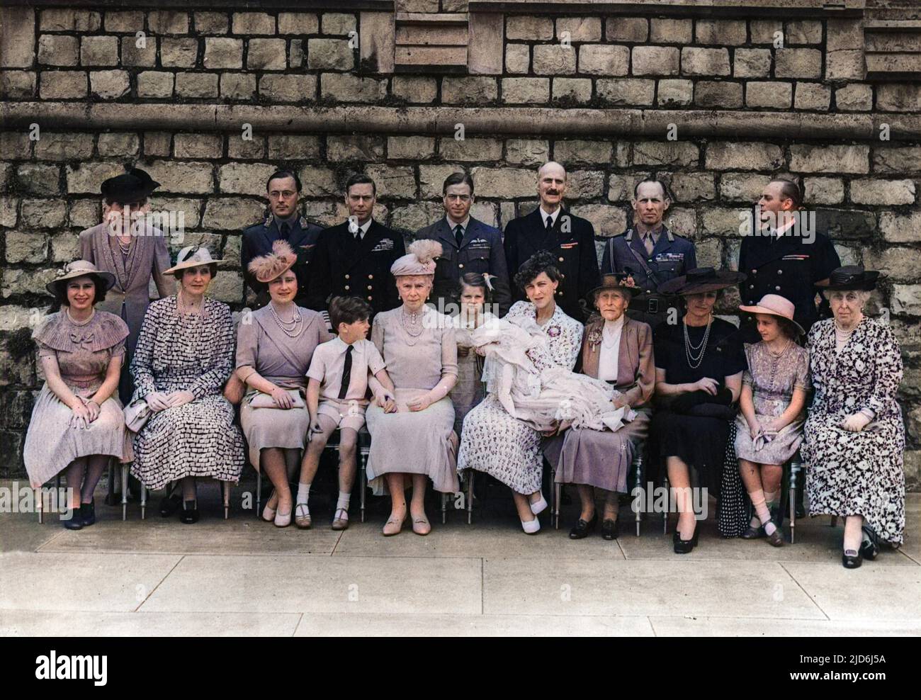 Christening of Prince Michael George Charles Franklin, third child of Prince George, Duke of Kent, and Princess Marina, Duchess of Kent.  He was born on 4 July 1942 and his father was killed in a flying accident while on duty when he was just seven weeks old.  Back row from left: Princess Marie Louise, Prince Bernhard of the Netherlands, King George VI, Duke of Kent, King Haakon of Norway, King George of the Hellenes, Crown Prince Olaf of Norway.  Seated from left, Princess Elizabeth (Queen Elizabeth II), Lady Patricia Ramsey (formerly Princess Patricia of Connaught), Queen Elizabeth, the Quee Stock Photo