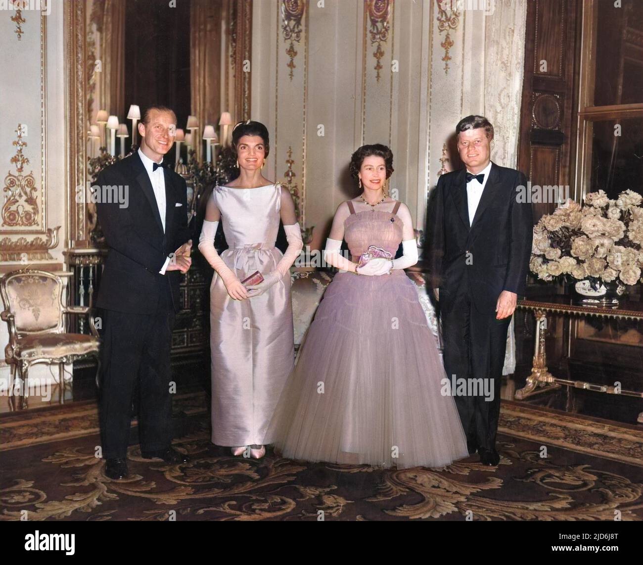President John F Kennedy and his wife Jackie, pictured with Queen Elizabeth II and Prince Philip, Duke of Edinburgh at a State dinner party given at Buckingham Palace during a visit by the Kennedys to London. Colourised version of: 10513552       Date: 1961 Stock Photo