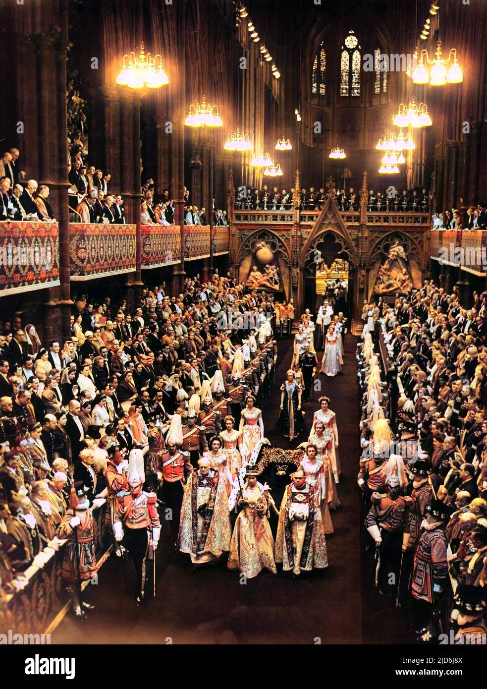 General view of the State Procession down the Nave led by H. M. The Queen, flanked by her Maids of Honour after the Coronation ceremony in Westminster Abbey on June 2nd 1953. Colourised version of: 10511417       Date: 1953 Stock Photo