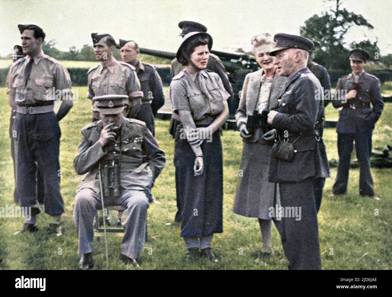 Mr. Winston Churchill and his youngest daughter Mary Churchill see anti-flying bomb defences. Mrs. Churchill is also present on this six hour tour of gun sites in Southern England, and is seen talking here to Gen. Sir Frederick Pile of Anti-Aircraft Command. Colourised version of: 10509477       Date: 1944 Stock Photo