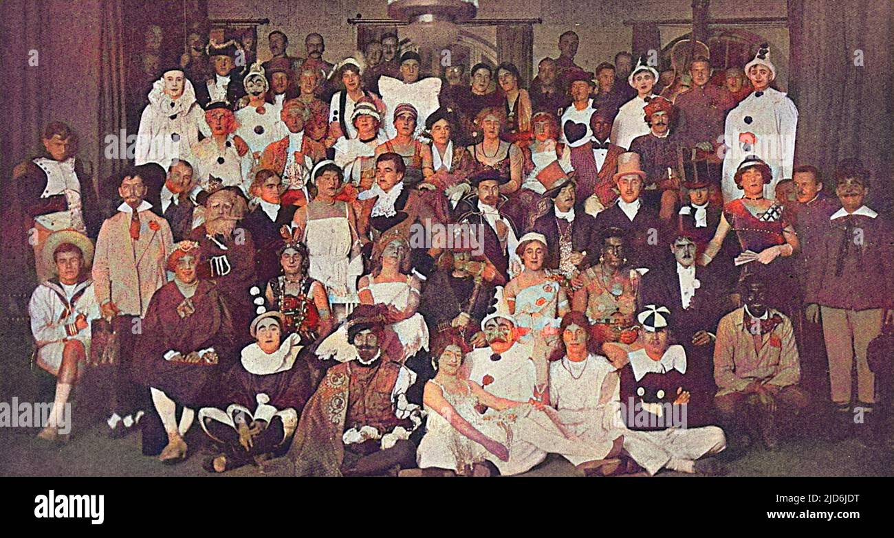 A fancy dress ball at Furstenberg in Mecklenburg which officer prisoners of war held as christmas entertainment in December 1916. The principal performers were British and Russian officers and among the costumes seen (remarkable considering the disadvantageous circumstances under which the organisers worked) are a pierrot, Napoleon, several clowns and a large number of ladies! Colourised version of: 10700642       Date: 1917 Stock Photo