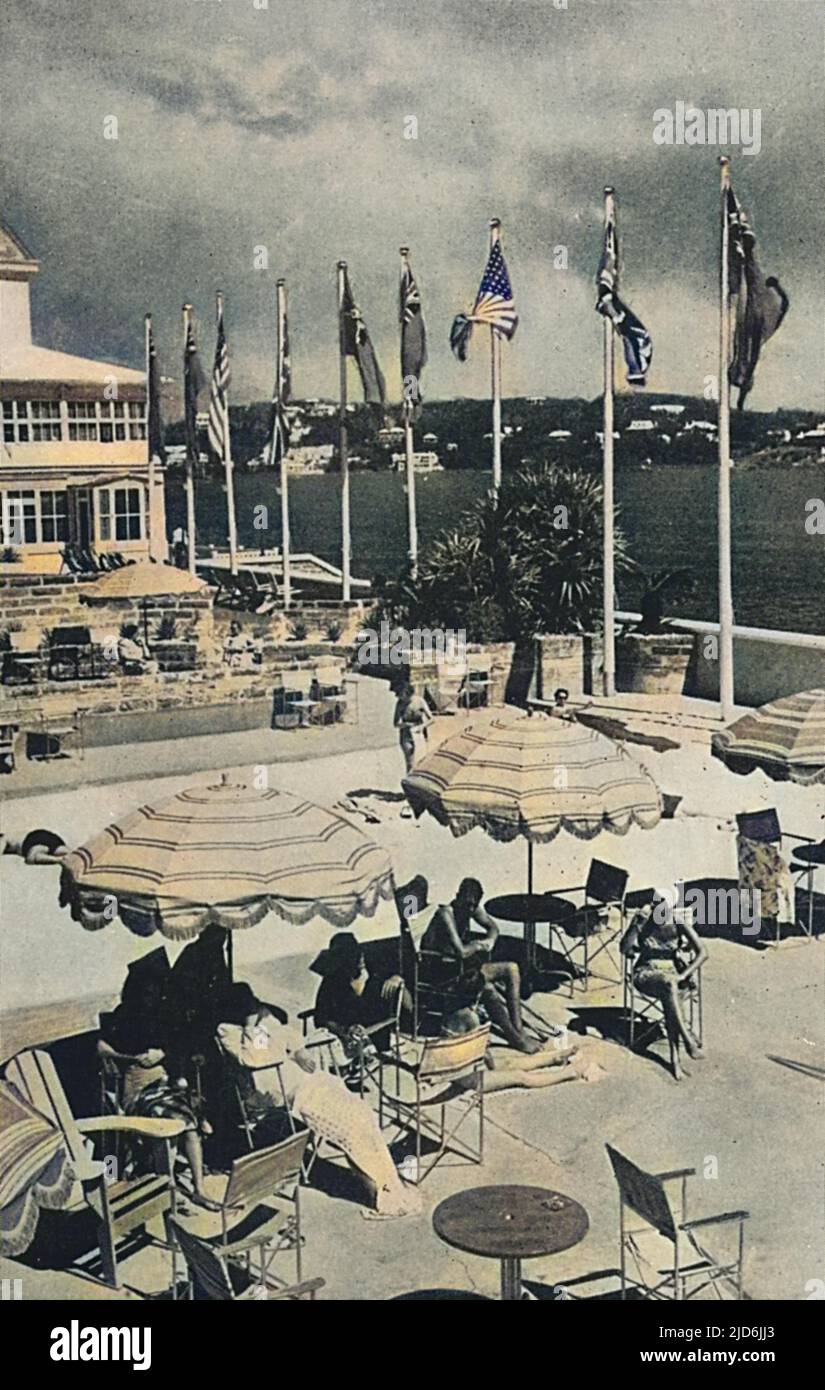 The Princess Hotel, Hamilton, Bermuda. The 'sparkling' salt water pool and sand beach - 'where sunning, swimming, a cocktail and lunch may be enjoyed.' Colourised version of: 10651801       Date: 1951 Stock Photo