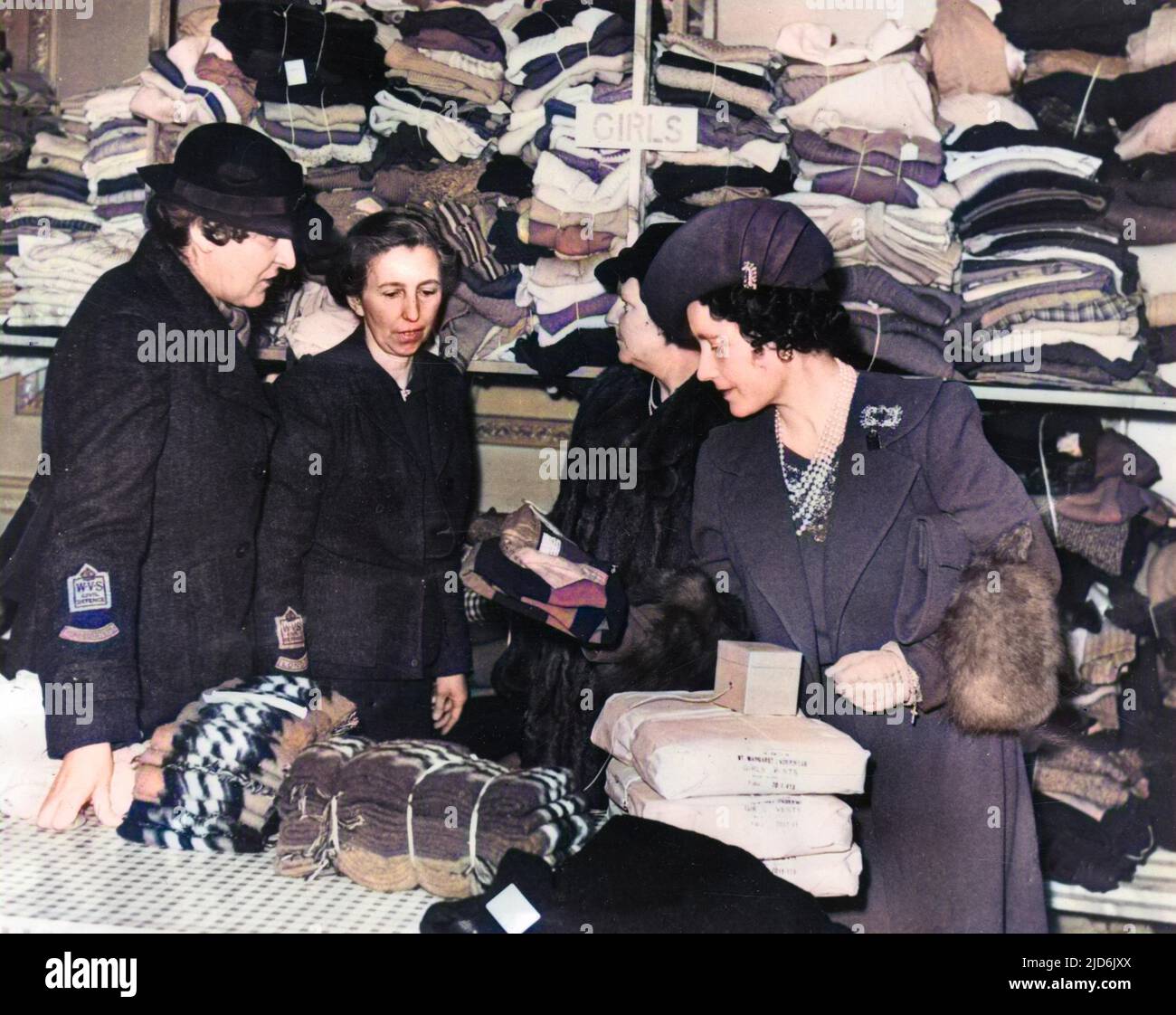 Inspecting a clothes distribution scheme for Air Raid victims (which have  arrived in Britain from New Zealand) - a visit by Queen Elizabeth & Eva  Violet Isaacs (n‚e Mond), Marchioness of Reading,