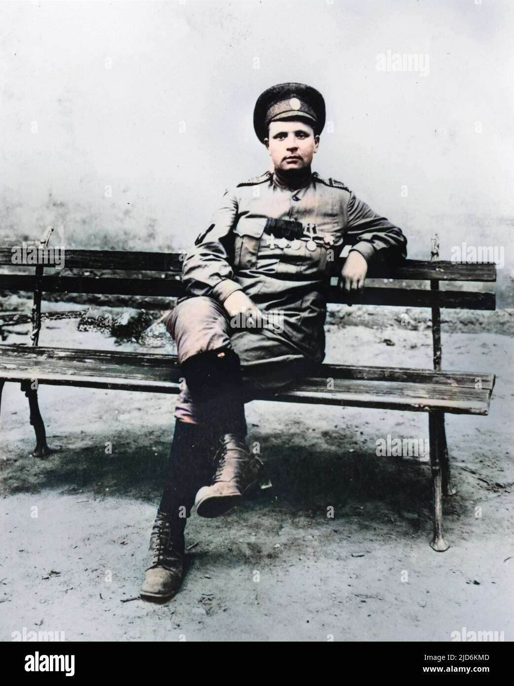 Maria Leontievna Bochkareva (nee Frolkova),  who fought in World War I and formed the First Russian Women's Battalion of Death in 1917.  Seen here in uniform in 1917, with her medals on display, sitting relaxed on a bench with her legs crossed. Colourised version of: 10294461       Date: 1889 - 1920 Stock Photo