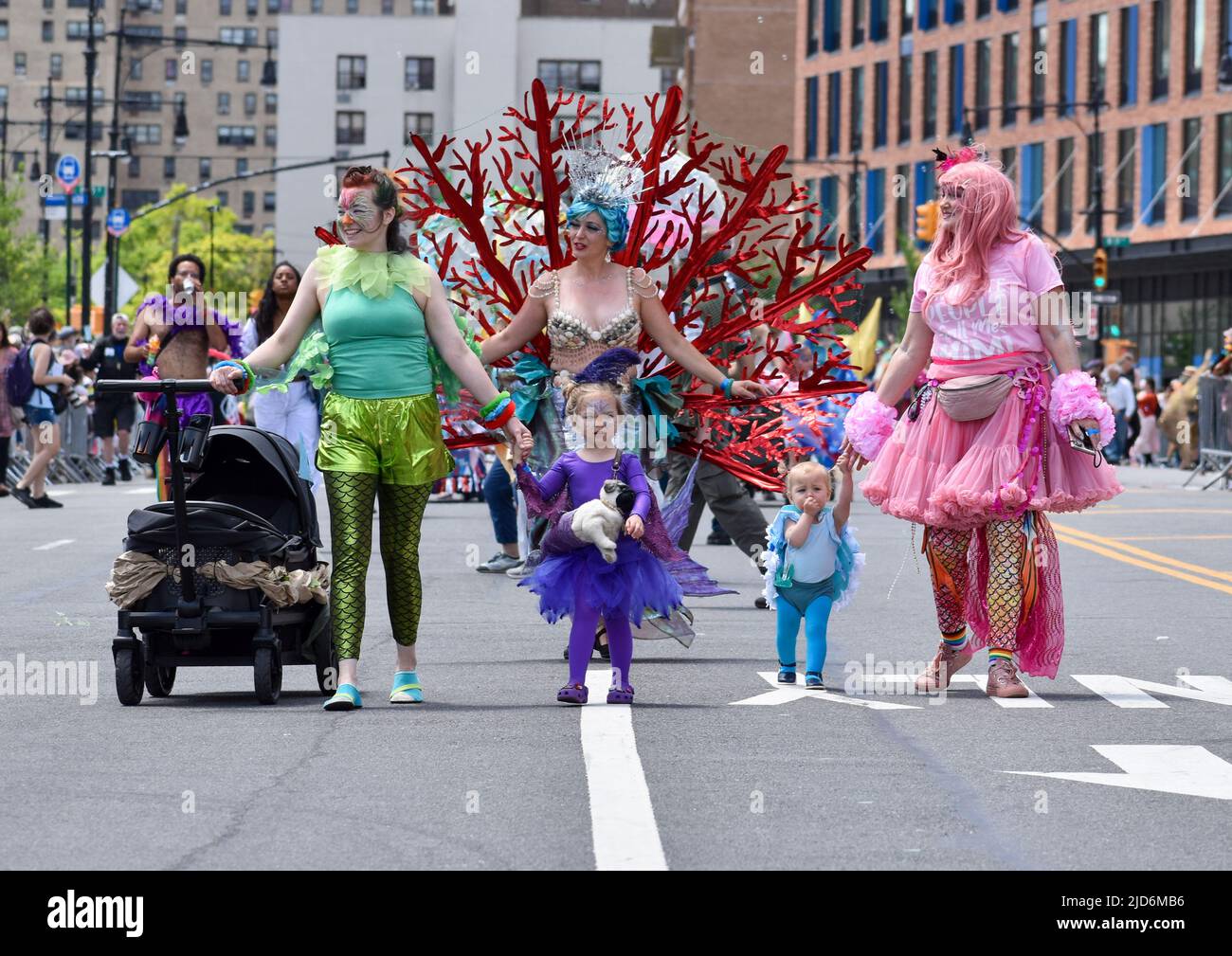 A family with their small children seen marching during the 40th annual