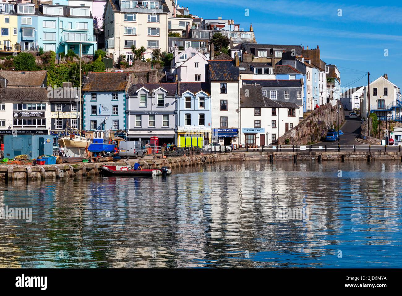 Brixham Harbour, Devon, England, UK: scenic view of bright relictions on a sunny day Stock Photo