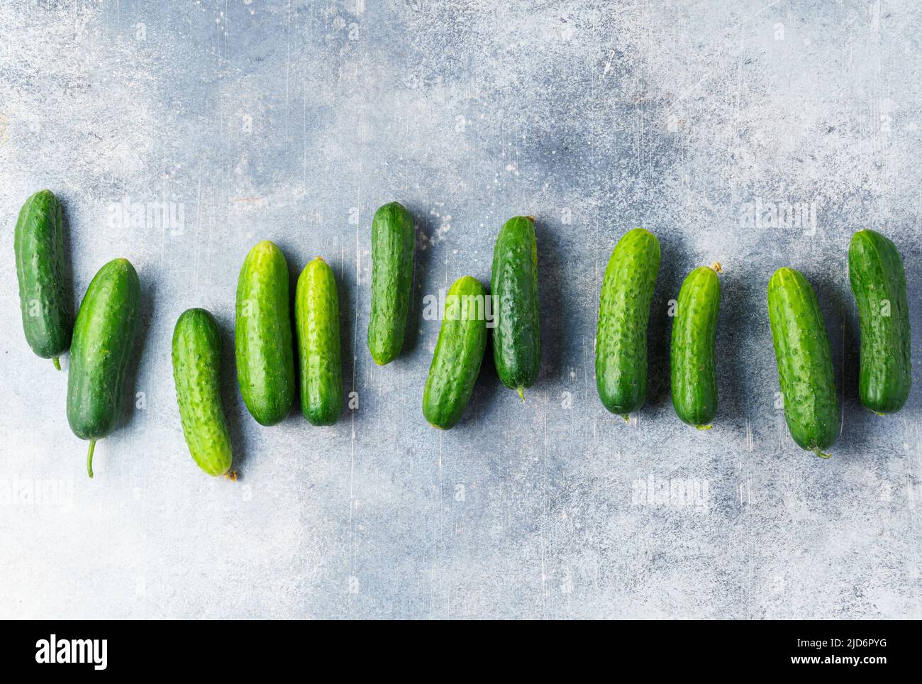 Cucumbers on concrete background top view Stock Photo