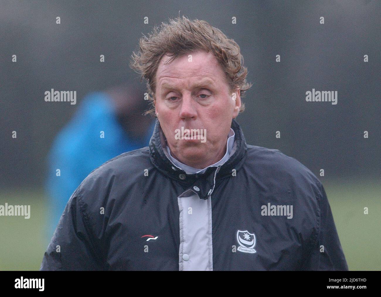 COLD , WET AND WIND BLOWN HARRY REDKNAPP DURING PORTSMOUTH'S TRAINING SESSION BEFORE THE LOCAL DERBY AGAINST SOUTHAMPTON. 19-03-04 PIC MIKE WALKER, 2004 Stock Photo