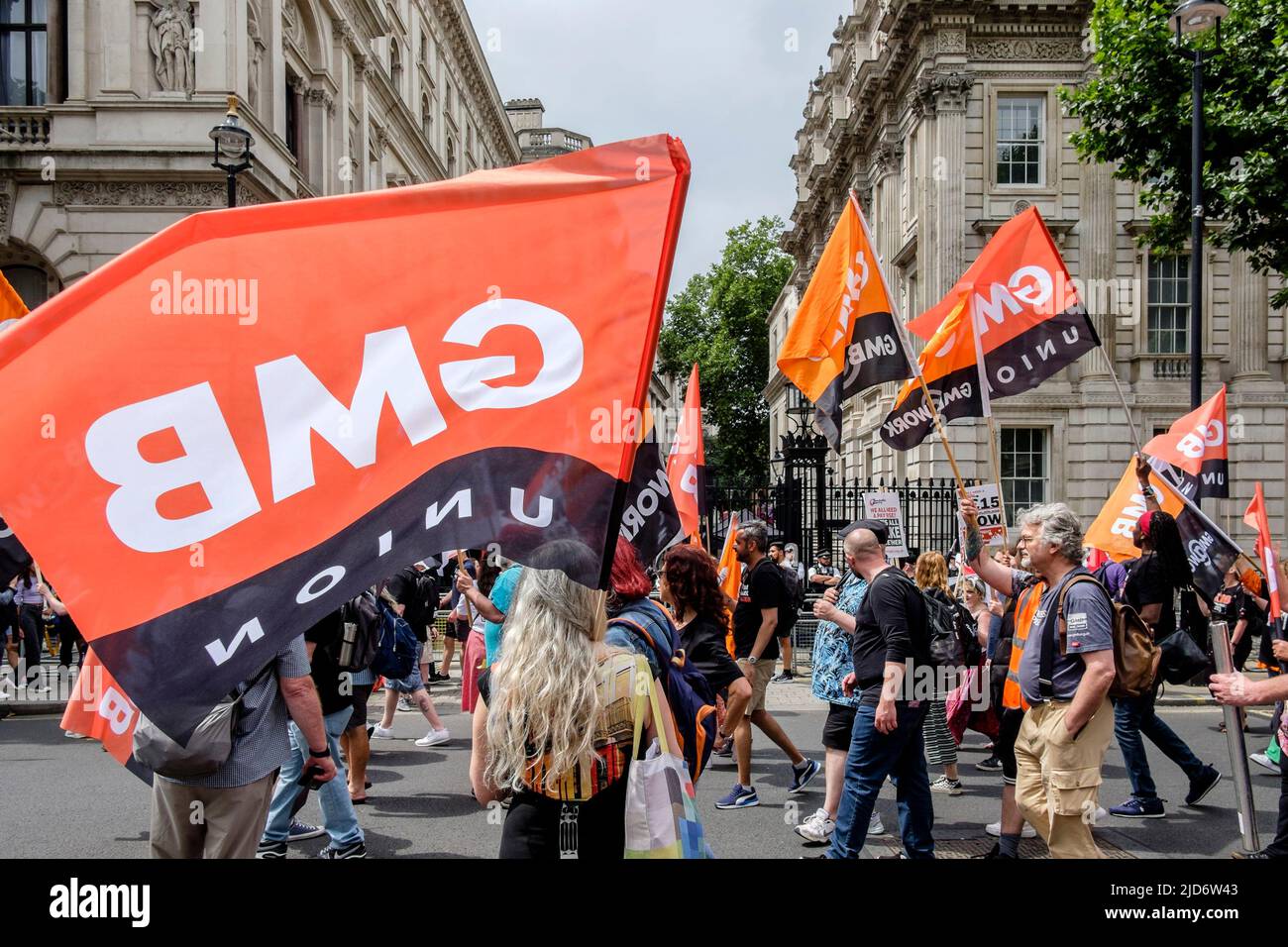 London UK, 18th May 2022. Thousands of trade union members march on the We Demand Better protest organised by the TUC against the UK government and the cost of living crisis. Members of the GMB union march past Downing Street Stock Photo
