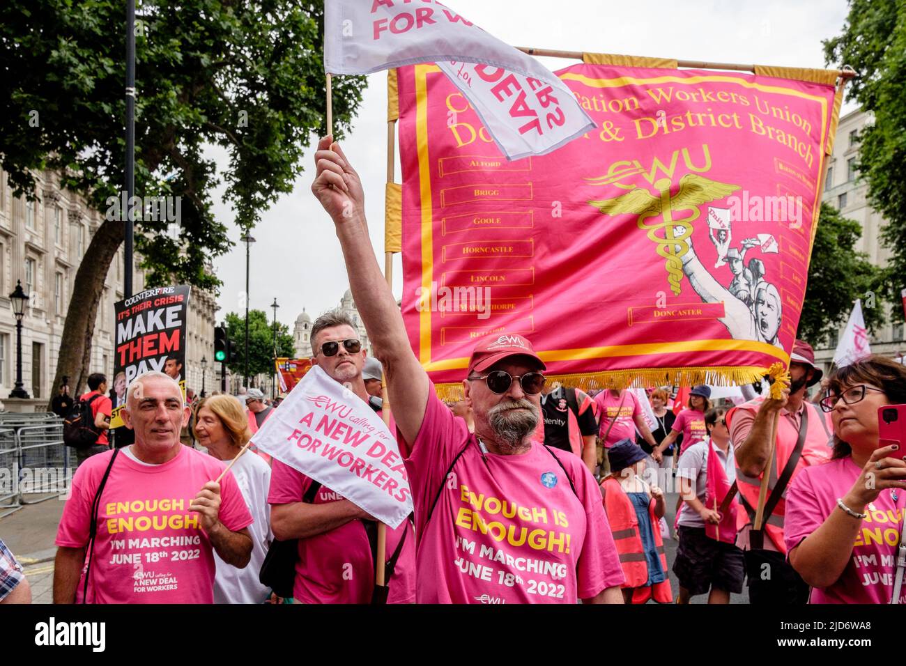 London UK, 18th May 2022. Thousands of trade union members march on the We Demand Better protest organised by the TUC against the UK government and the cost of living crisis. Members of the Communication Workers Union march in Whitehall/ Stock Photo