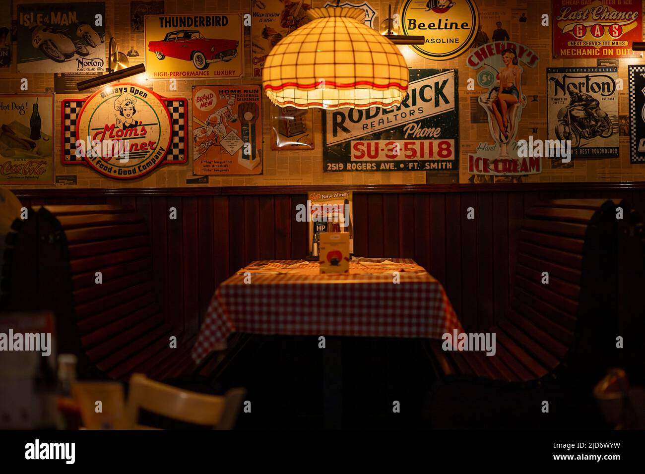 interior of a restaurant with retro posters Stock Photo - Alamy