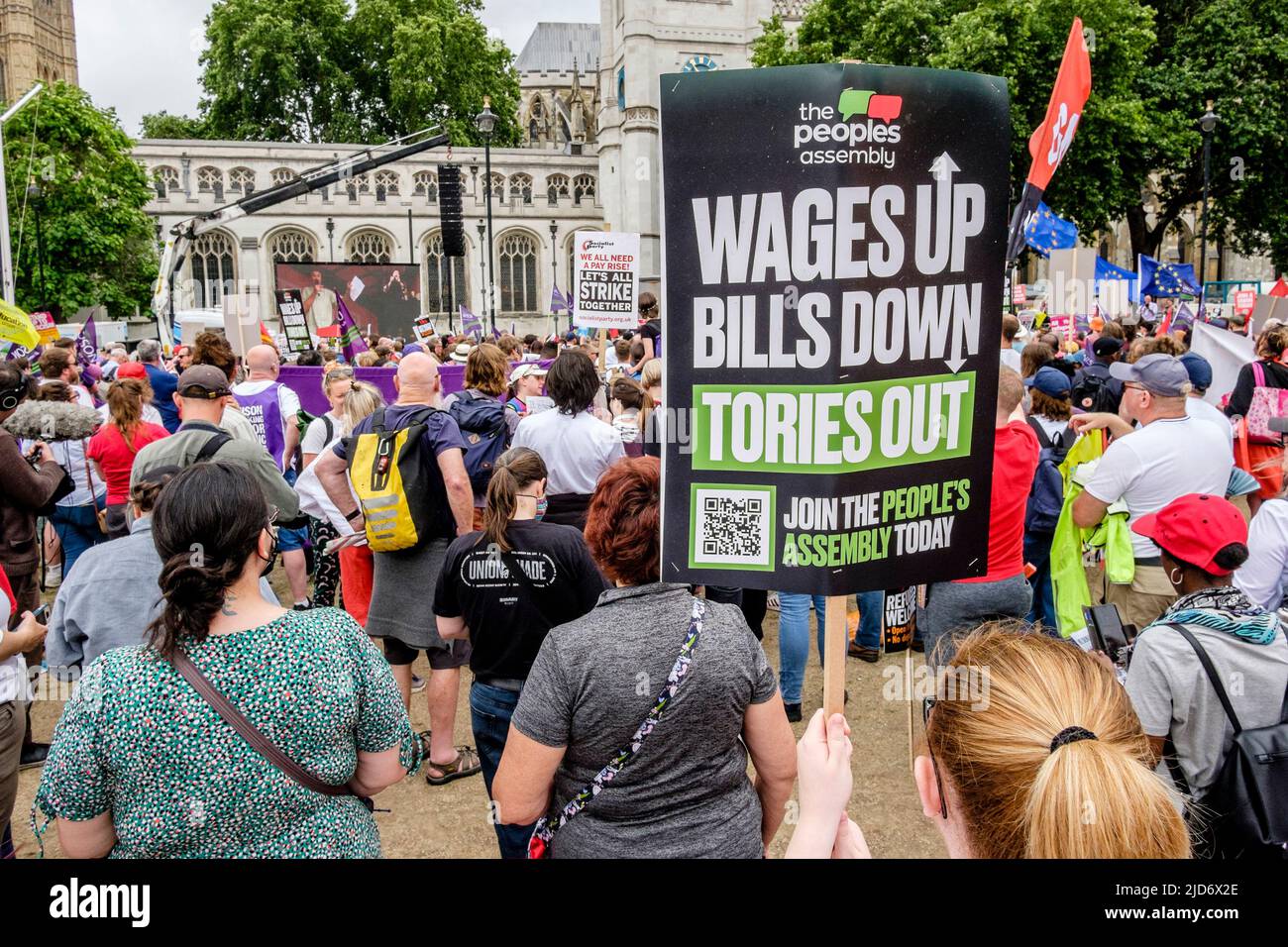 London UK, 18th June 2022. Thousands of trade union members march on the We Demand Better protest organised by the TUC against the UK government. Placards call for a rise in workers' wages and reduction in household bills. Stock Photo