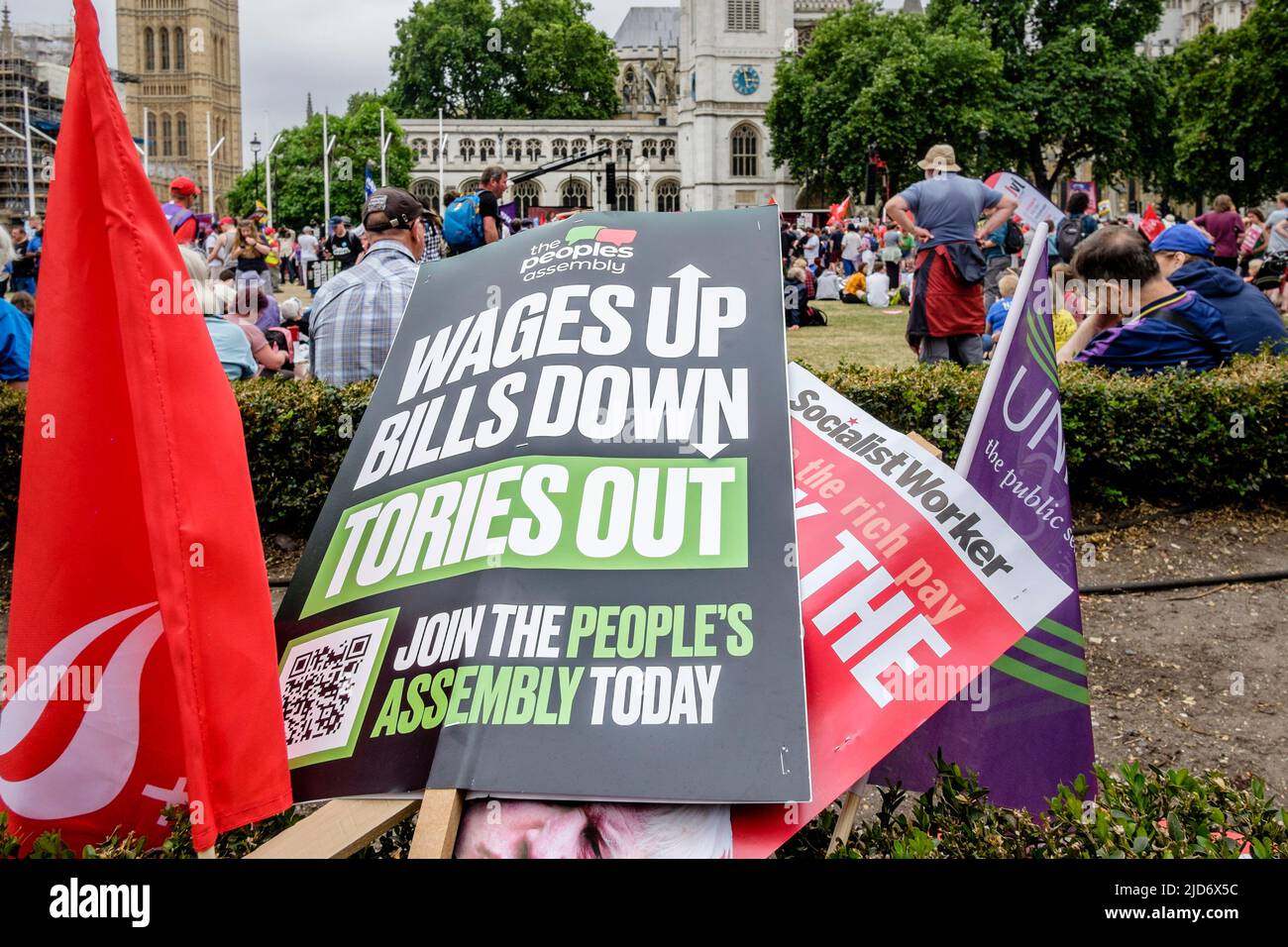 London UK, 18th June 2022. Thousands of trade union members march on the We Demand Better protest organised by the TUC against the UK government. Placards call for a rise in workers' wages and reduction in household bills. Stock Photo