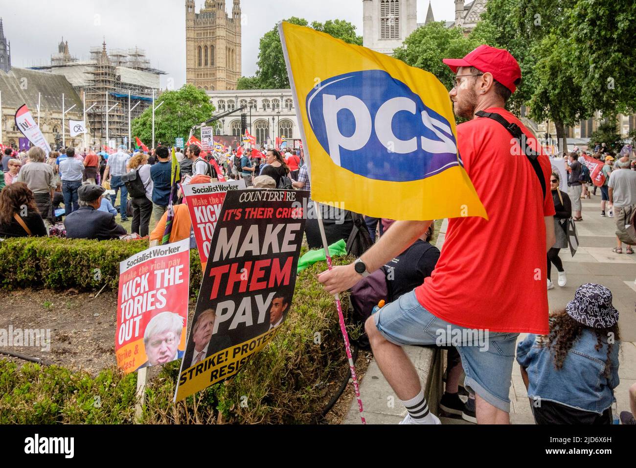 London UK, 18th May 2022. Thousands of trade union members march on the We Demand Better protest organised by the TUC against the UK government and the cost of living crisis. A Public and Commercial Services Union member at the rally in Parliament Square. Stock Photo