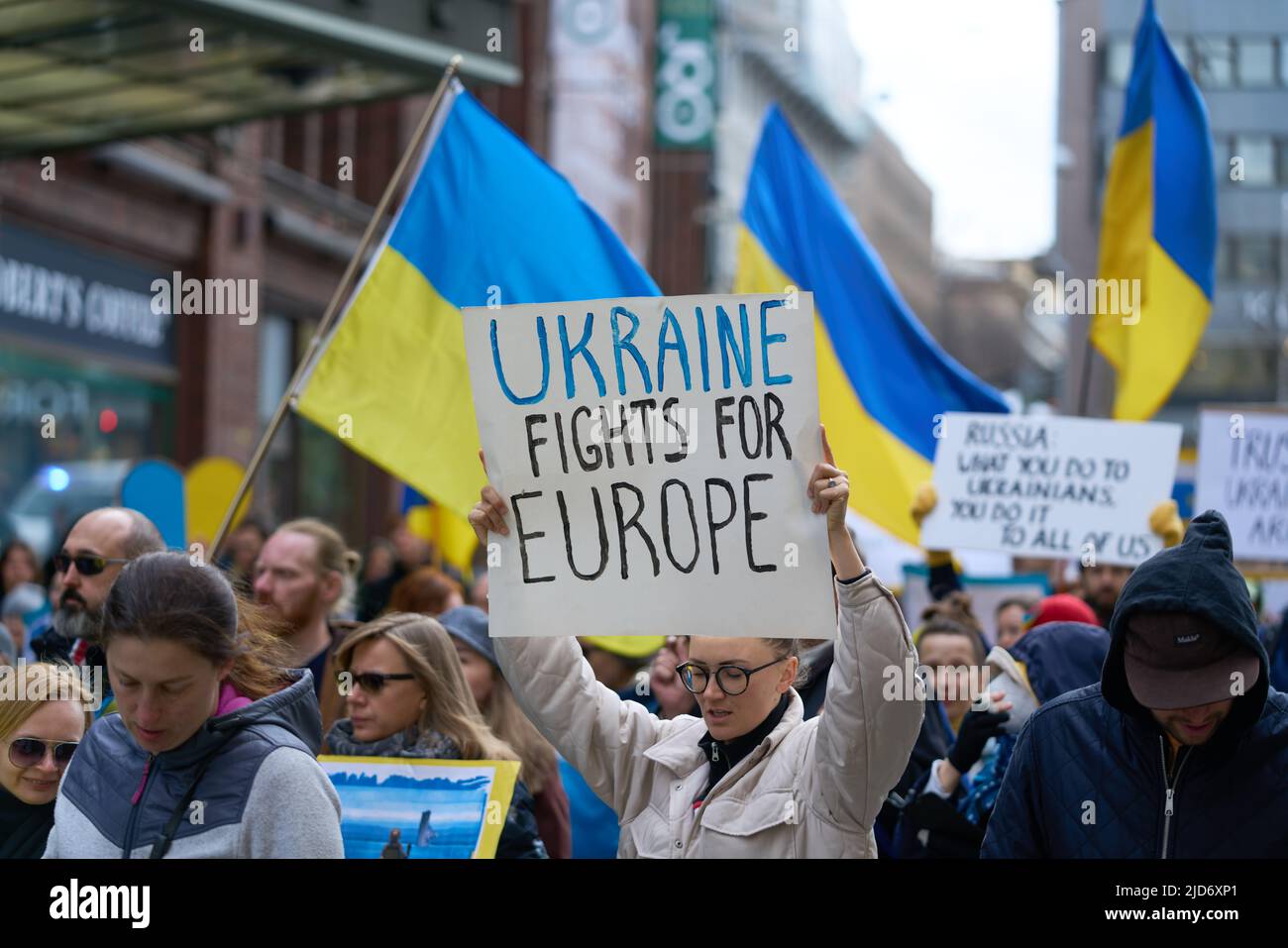 Helsinki, Finland - April 23, 2022: Demonstrator in a rally against Russia’s military aggression and occupation of Ukraine carrying Ukraine Fights For Stock Photo
