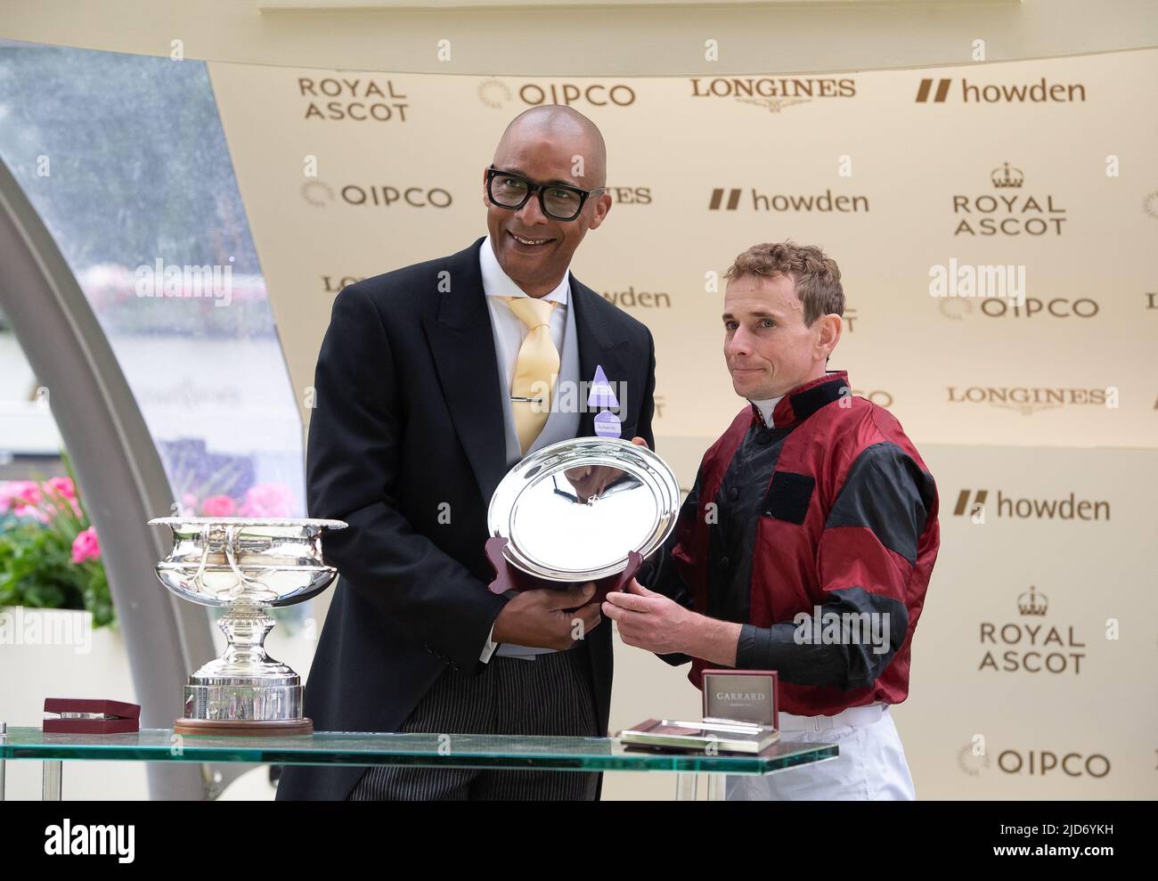 Ascot, Berkshire, UK. 18th June, 2022. Jockey Ryan Moore was crowned the leading jockey at this year's Royal Ascot. TV Personality Jay Blades MBE presented the prize to him. Credit: Maureen McLean/Alamy Live News Stock Photo