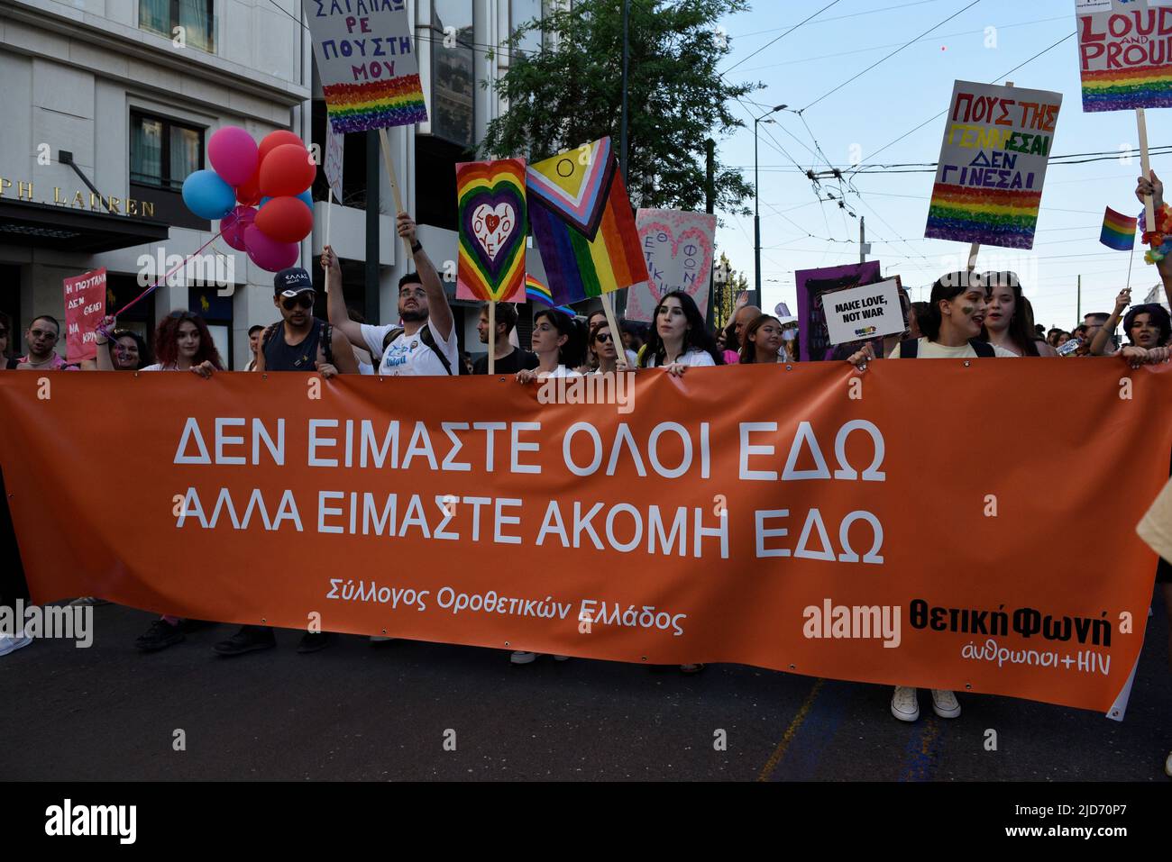 Athens, Greece. 18th June, 2022. People march waving rainbow flags and holding placards, during the Athens Pride anual parade. Thousands demonstrated during the Athens Pride 2022 parade to raise awareness, elevate the visibility of LGBTQ persons in Greek society and defend their rights against sexual discrimination. Credit: Nikolas Georgiou/Alamy Live News Stock Photo