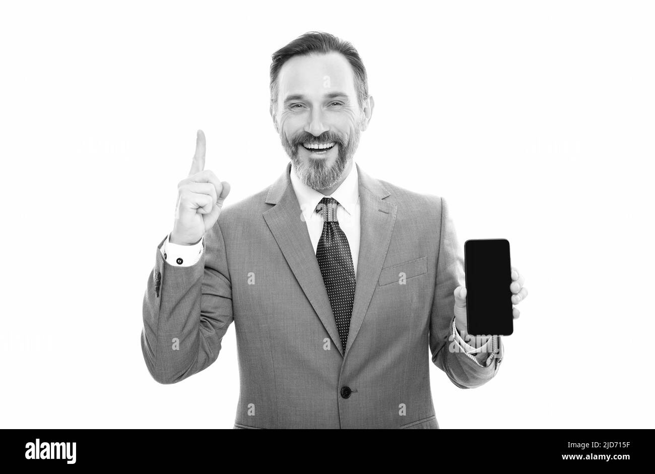 happy grizzled entrepreneur presenting modern smartphone isolated on white copy space, advise. Stock Photo