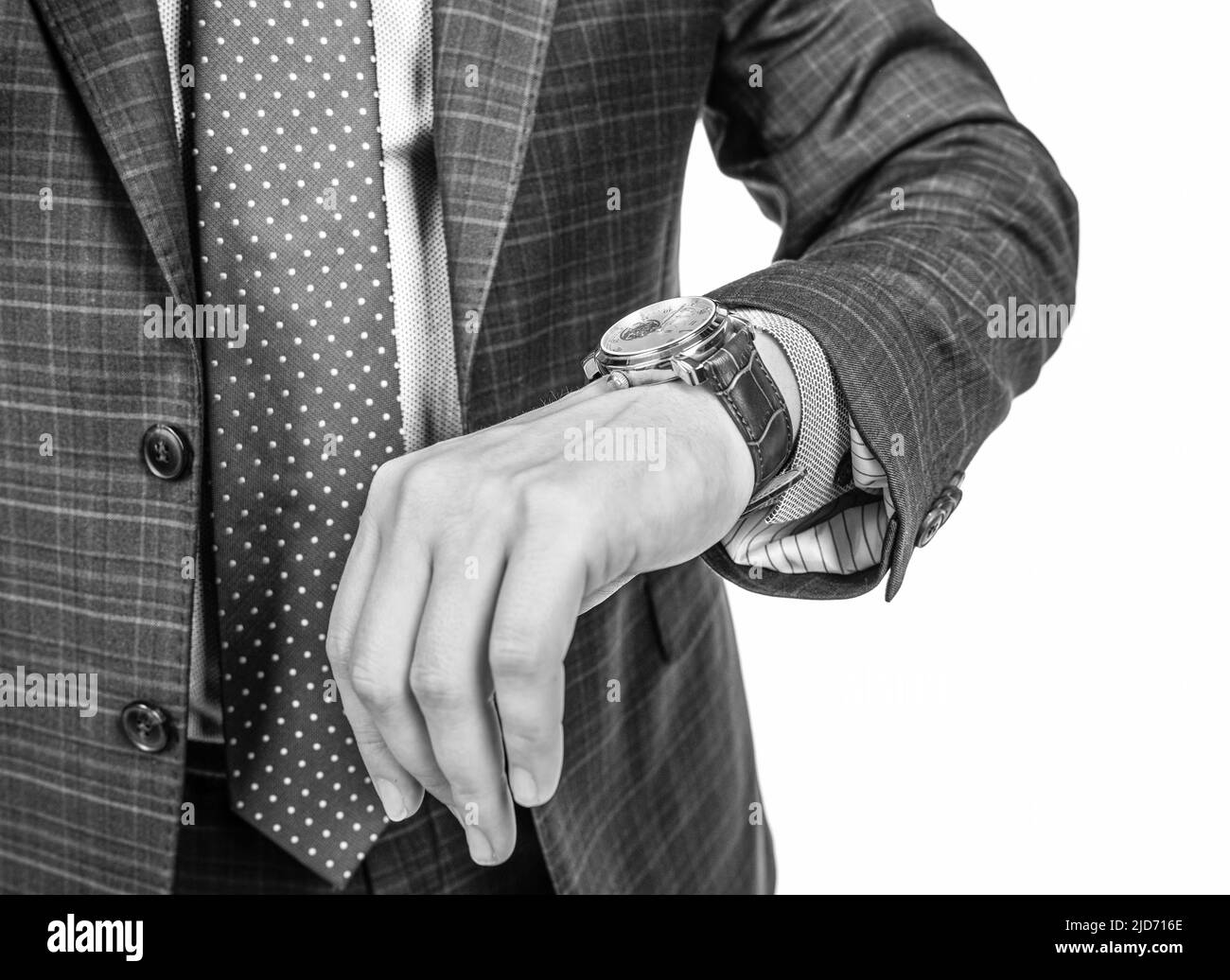 Man in formal suit cropped view check time by wrist watch isolated on