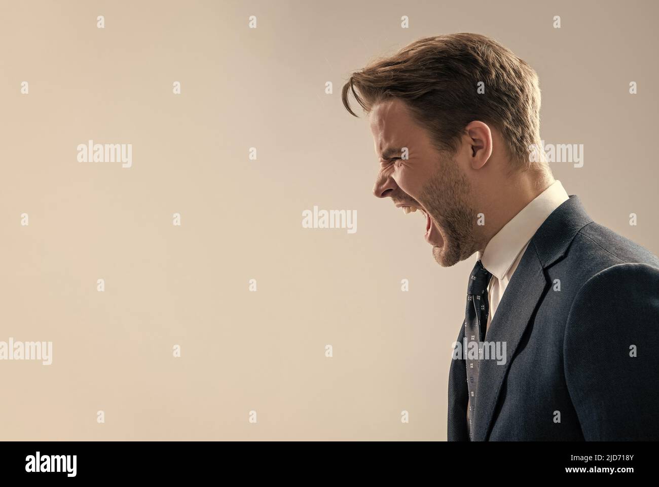 Yelling and screaming. Angry man yell grey background. Manager scream