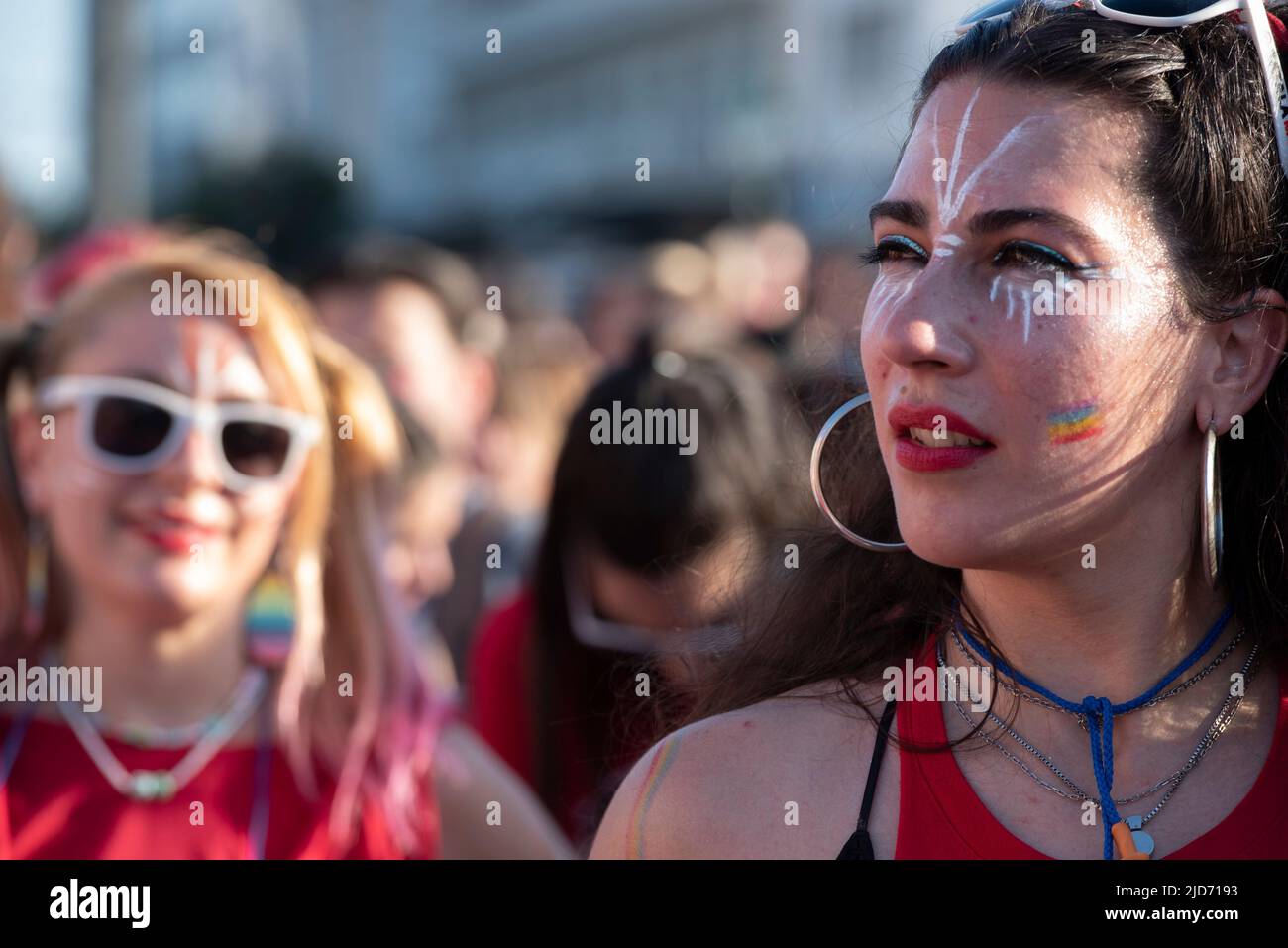 Athens, Greece. 18th June, 2022. People march waving rainbow flags and