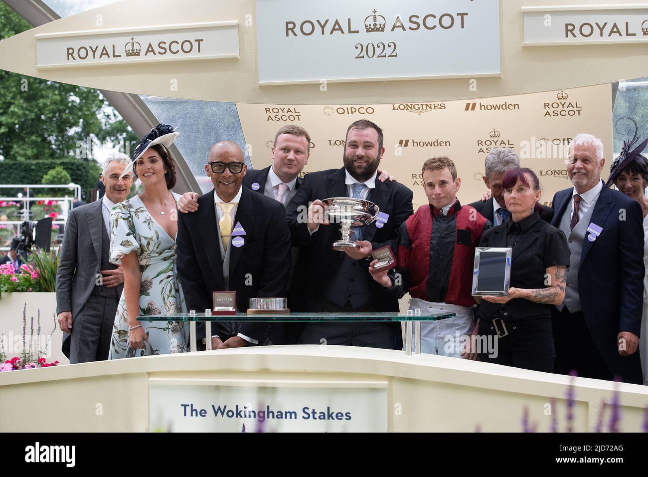 Ascot, Berkshire, UK. 18th June, 2022. Horse Rohann ridden by jockey Ryan Moore wins the Wokingham Stakes. The winning owners and trainer presentation was made by TV personality Jay Blades MBE who is known for appearing on the programme The Repair Shop and his upcycling projects. Credit: Maureen McLean/Alamy Live News Stock Photo