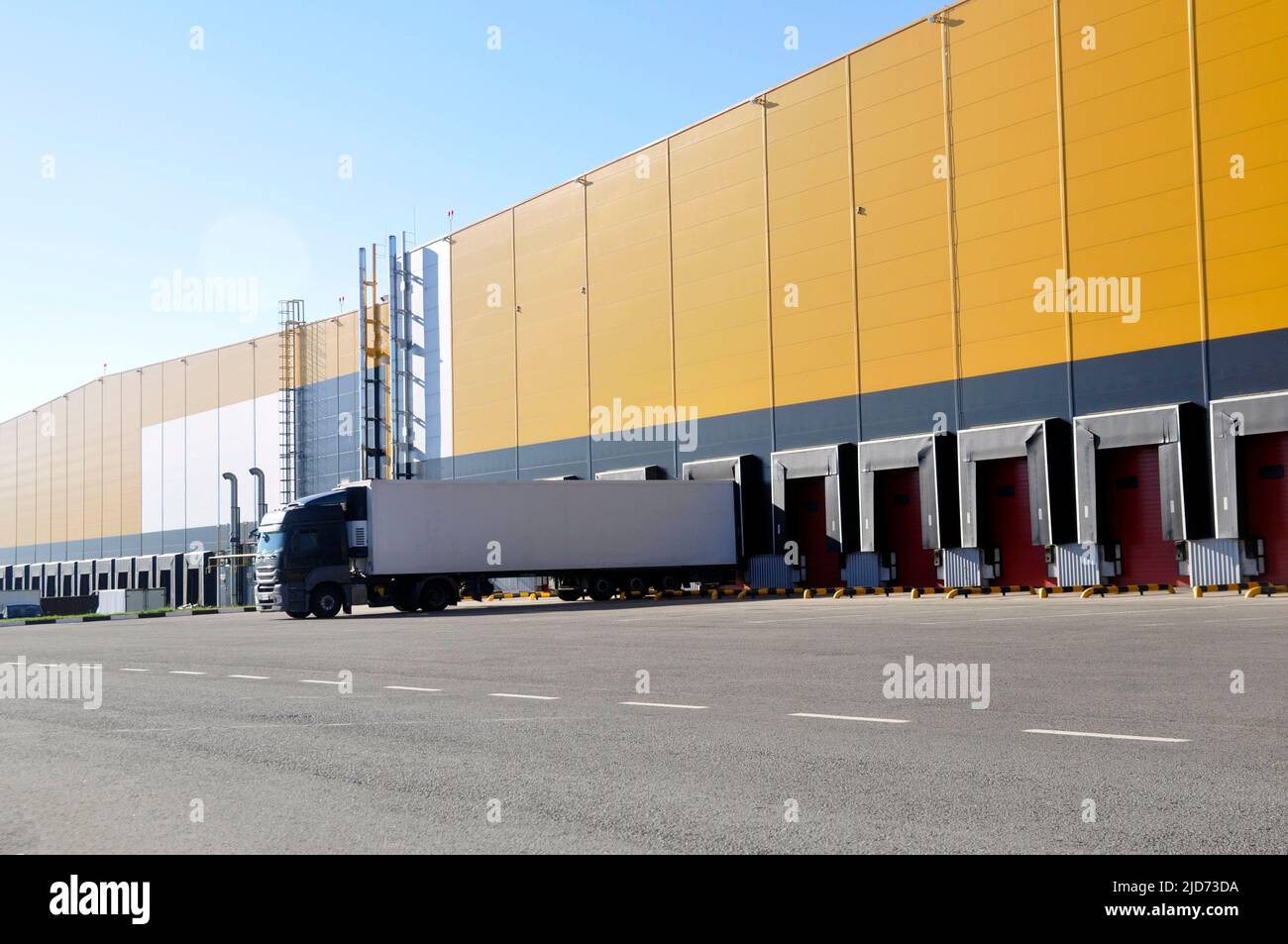 Warehouse Rear Unloading Unloading trucks in a modern warehouse complex. Transportation, storage ...