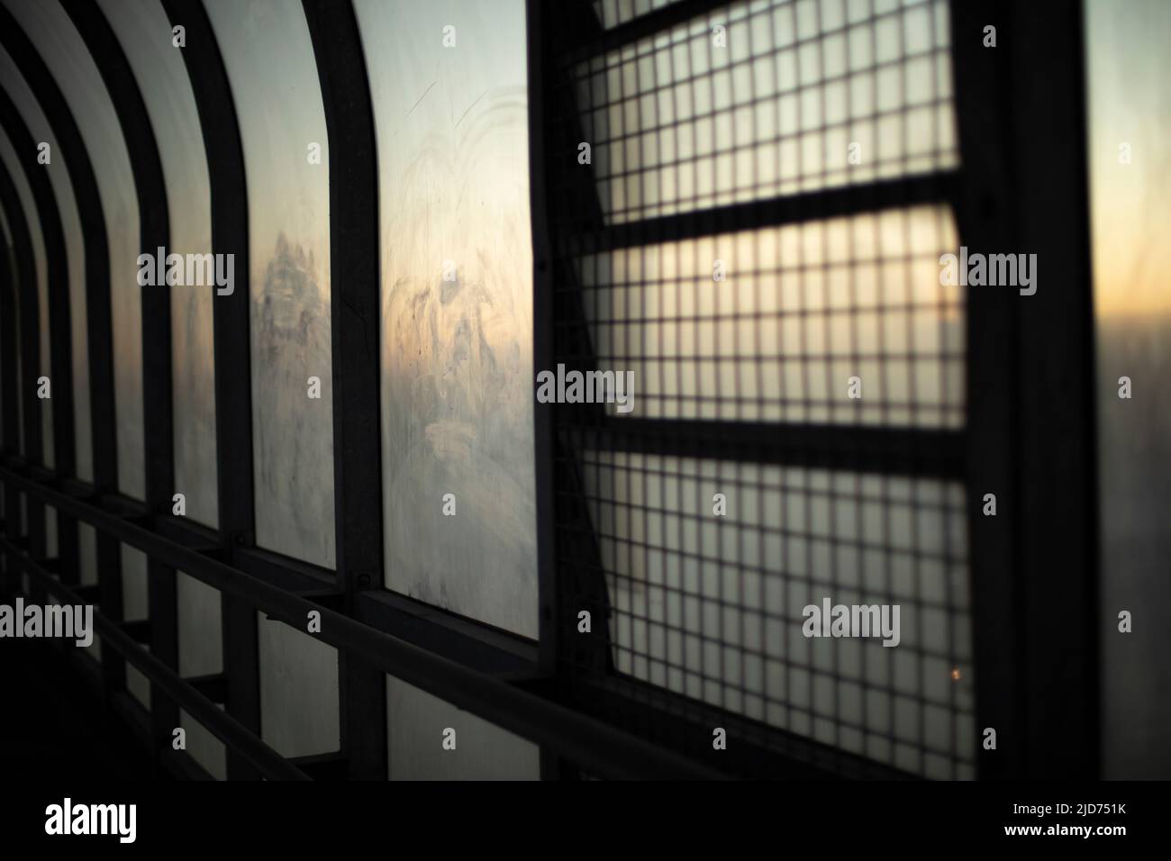 Inside tunnel. Window details. Light in city building. Glass in dust ...