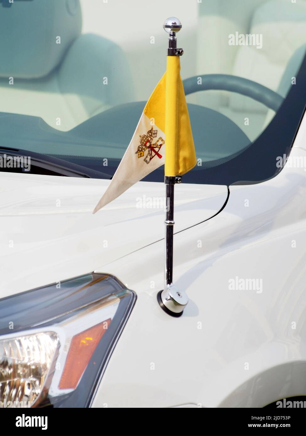 The Vatican flag on the Popemobile, a modified Chevrolet Traverse V6 3.6L 281HP, to be used in Peru during the next visit of Pope Francis I, is introduced to the press. Stock Photo
