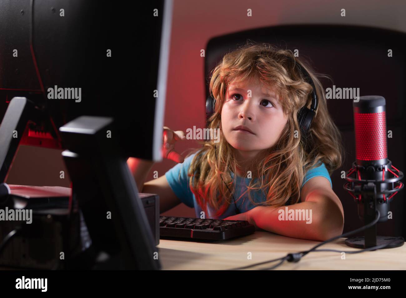 Cute preschool child watching video lesson by laptop Stock Photo - Alamy